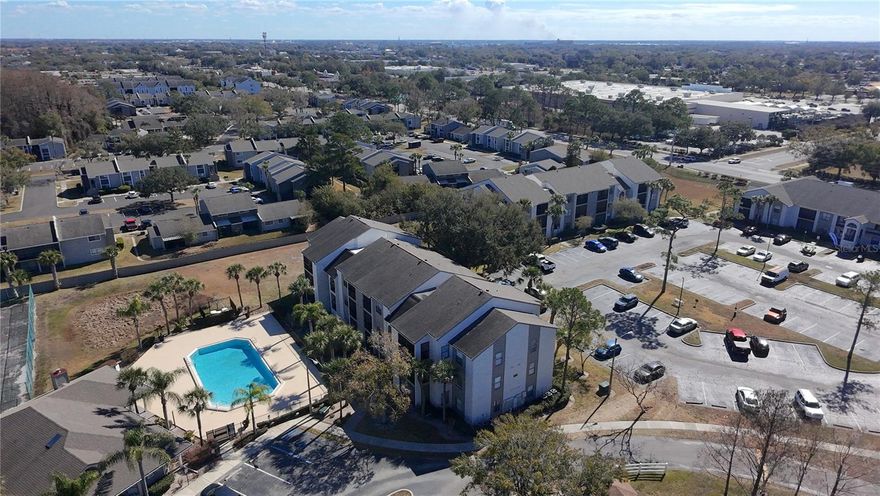 Discover comfort and convenience at Cascades at Kissimmee with this well-maintained 2-bedroom, 1-bath condominium offering approximately 870 square feet of thoughtfully designed living space. The interior features an open, airy floor plan with abundant natural light, a welcoming living and dining area, and a stylish galley kitchen complete with breakfast bar and updated appliances—ideal for both everyday living and entertaining.

The generously sized primary bedroom includes a walk-in closet and private access to the renovated full bath. Recent improvements such as fresh interior paint enhance the home’s clean, modern feel. Enjoy outdoor relaxation on the screened balcony, which also provides additional storage, plus the added convenience of an in-unit washer and dryer.

Residents enjoy access to community amenities including a swimming pool within view from the balcony, clubhouse, and tranquil pond views. Centrally positioned near major roadways, shopping, restaurants, and entertainment, with easy drives to The Loop, area attractions, and Orlando International Airport. A great option for owner-occupants or investors alike—ready for immediate occupancy. Schedule your private tour today.