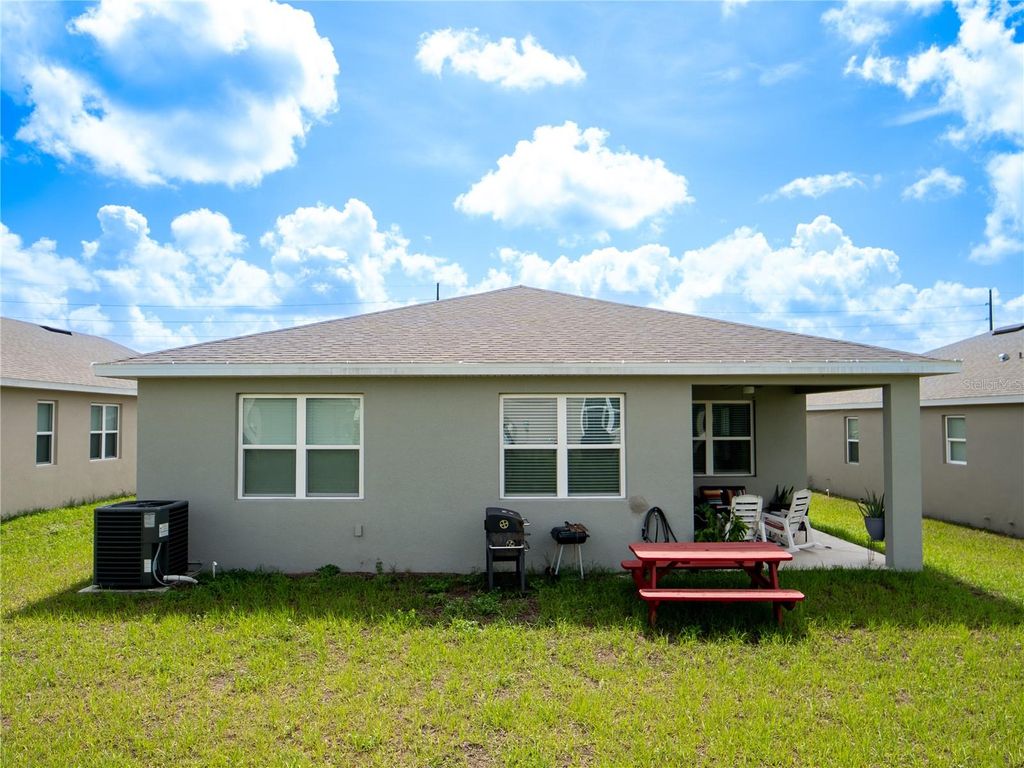 Photo of 233 Hilltop Bloom Loop, Haines City, FL 33844 (MLS # S5135729)
