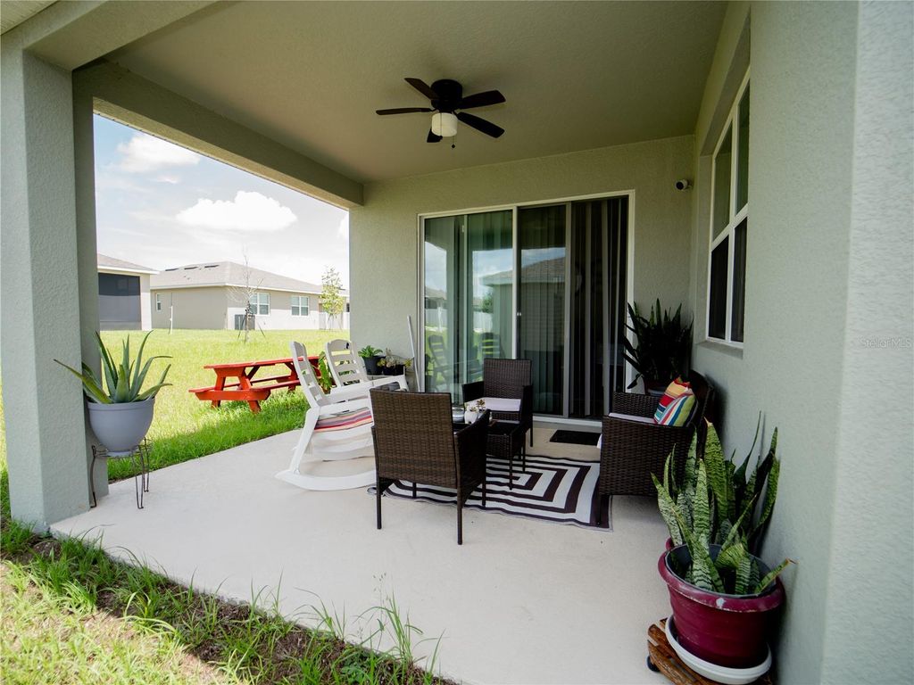Photo of 233 Hilltop Bloom Loop, Haines City, FL 33844 (MLS # S5135729)