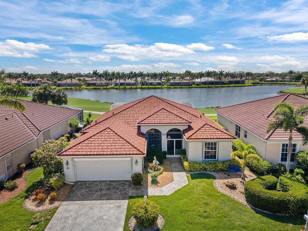 This spacious well cared for home in the lovely Herons Glen Golfing community is truly a gem. Tranquility at its best will sum it up. The Metal roof installed in 2023 has the appearance of barrel tile. The lush landscaping and welcoming front porch is inviting. When walking through the double door entry you instantly experience elegance. There is a large open feel throughout and the upgraded features are evident. The pool/lanai area is tranquil and offers a spectacular view, it is a wonderful place to appreciate the Florida lifestyle.