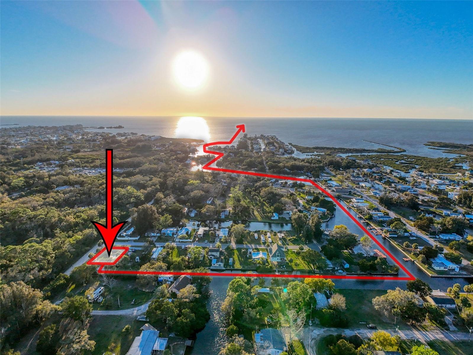 This FENCED-IN WATERFRONT LOT is located in the CONNERS SUB SUBDIVISION featuring 70ft of WATERFRONT, a CONCRETE SEAWALL, a PRIVATE BOAT RAMP PERFECT for KAYAKING, CANOEING or FLAT BOATING with ACCESS to the GULF OF MEXICO. All of your local restaurants like INN ON THE GULF, SAM'S BEACH BAR, OLLIE"S ON THE BEACH and GET HOOK are a 5 minute drive. HOSPITALS & SHOPPING as well. The TAMPA BAY AIRPORT, TAMPA BAY, CLEARWATER BEACH, HOMMOSSA SPRINGS, TARPON SPRINGS, PINE ISLAND, HONEYMOON ISLAND and WEEKI WACHEE are approximately 1 hour away. Build your DREAM HOME. FISH & CRAB off your own dock or take a KAYAK, JET SKI or BOAT RIDE to the GULF OF MEXICO where the FISH ARE PLENTIFUL, the FUN is NEVER ENDING and the SUNSETS are ALWAYS AWESOME! MORE PHOTOS COMING SOON!