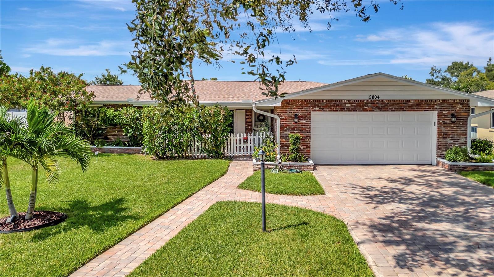 Enjoy true Florida living in this GORGEOUS 3-bedroom, 2-bathroom home situated on over a quarter-acre with countless upgrades inside and out. This home has been updated for both comfort and peace of mind, featuring a WHOLE-HOUSE GENERATOR (2024), HURRICANE SHUTTERS, NEWER ROOF (2022), A/C (2024), ENERGY-EFFICIENT WINDOWS (2019), and NEW PAVERS (2019). Step inside to discover the updated gourmet kitchen (2019), complete with modern finishes, granite countertops, sleek cabinetry, opening seamlessly to the formal dining room...great for entertaining! The split floor plan offers three spacious bedrooms providing privacy and comfort for family and guests. Relax year-round by the heated, caged-in pool with an updated pool pump (2018), and enjoy the HUGE paver patio... truly a fabulous retreat! Surrounded by lush landscaping, this property also features a garden, shed for extra storage, and an irrigation system supplied by a private well to keep everything green year-round. With lots of built in cabinets, the oversized 2-car garage offers tons of extra storage. Close to shopping, restaurants and the pristine beaches of Anna Maria Island. This is the perfect place to call home.