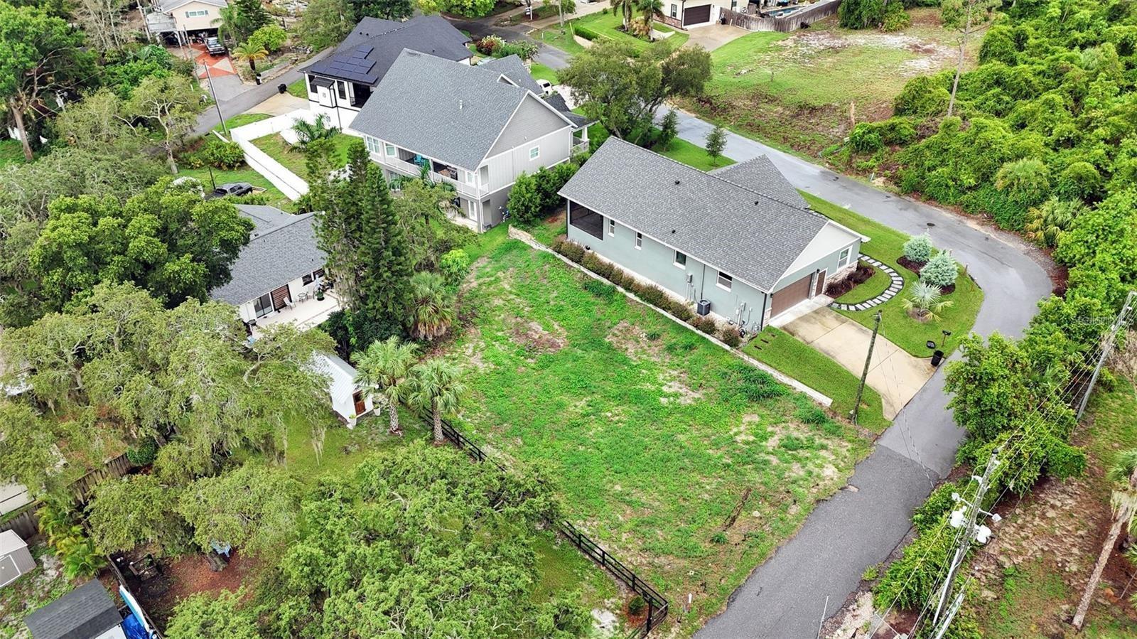DO NOT miss out on building your dream home from the ground up nestled in the rolling hills on the West Shores of Lake Tarpon. There are not many undeveloped lots left in Tarpon Springs so now is your chance!!! This parcel is located in the historical 1924 platted Gnuoy Park subdivision. It is perfect for the buyer looking for private, quiet and secluded YET still close enough to shopping, dining, golf courses and more. Best of both worlds!!! The new owner will be near to Anderson County Park, close to the amazing and well-known Tarpon Sponge Docks with its Greek influence. Downtown Tarpon Springs has great shopping, fine dining and great breweries. If this is not enough to entice the pickiest of buyers, this lot is not in a flood zone and no HOA. Also, less than an hour away from Tampa International Airport as well as St. Pete/Clearwater airport. The owner has already done all the hard work with permits done and building plans ready to go if the new buyer wants to see or use them. Now is the time to bring your builder and build your home YOUR WAY!!!