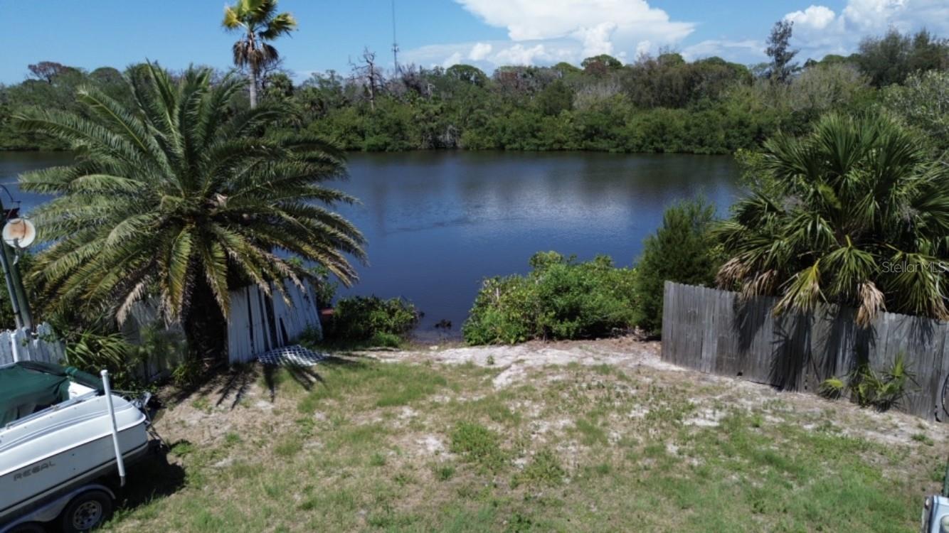 OWN YOUR OWN WATERFRONT LOT - A PIECE OF PARADISE IN NEW PORT RICHEY, FL and NO HOA fee! Enjoy swaying in your hammock in the breeze with your fishing pole in the water catching your dinner! Or take your kayak or canoe out for an afternoon on the bayou. And, for a slightly longer adventure, paddle out to the Gulf. Close to exciting downtown New Port Richey makes this an ideal location. In addition, Robert Kees Memorial Park is a short golf cart ride away where one can enjoy a day at the beach or perhaps a stroll on the boardwalk while watching the sunset. Truly, this slice of Heaven will not last long. This manufactured home park is under the City of New Port Richey, so interested purchasers are recommended to call for more details about the building requirements. Note: The boat on the property belongs to the seller and can be considered for separate purchase. It is not part of the land purchase price. Don't delay, call today!