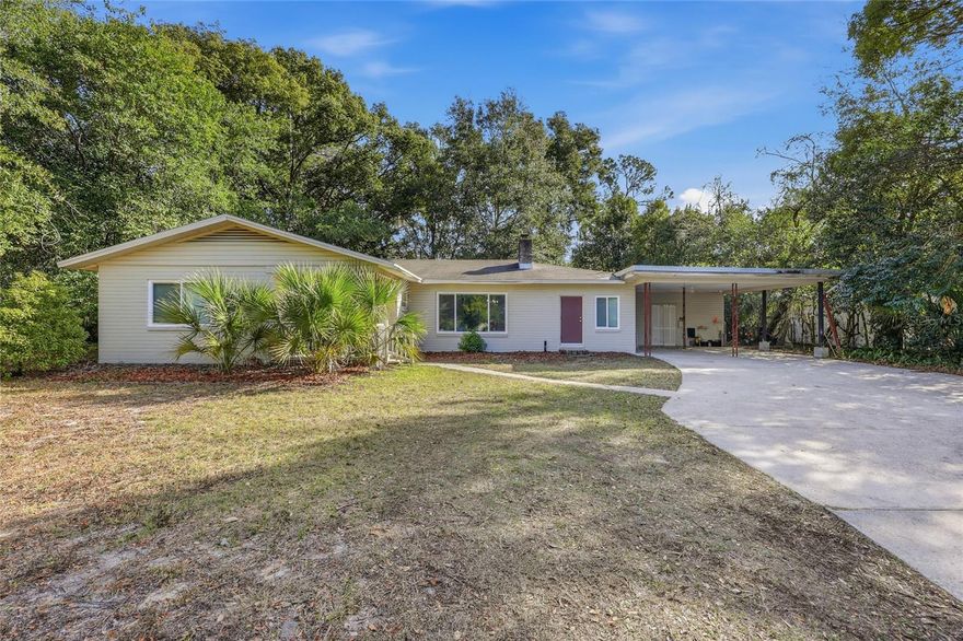 Welcome home to this beautifully updated brick residence just minutes from the University of Florida. This flexible 4 bedroom, 3 bathroom property includes a 1/1 suite with separate entry offering great options for extended family, guests, or potential rental income. The main living and dining area feels inviting with its wood-burning fireplace and custom built-ins. The kitchen blends character and convenience with wood cabinetry, a painted brick accent wall, built-in double ovens, a gas cooktop, stainless steel appliances, and newly installed granite countertops. All bedrooms are comfortable in size, and the primary bedroom offers its own private bath. The attached 1/1 suite provides even more versatility with a full bedroom, en-suite bath, and an additional office space that works perfectly for studying or working from home. Recent improvements include new windows, new LVP flooring, resurfaced tubs and showers, and the new granite counters in the kitchen. With no carpet throughout, a screened lanai overlooking the spacious backyard, a two-car carport with extra storage, and plenty of additional parking, this home is ready for everyday living. Whether you are looking for a personal home close to UF, a multigenerational layout, or an income-producing opportunity, this home offers comfort, charm, and convenience in a prime Gainesville location.