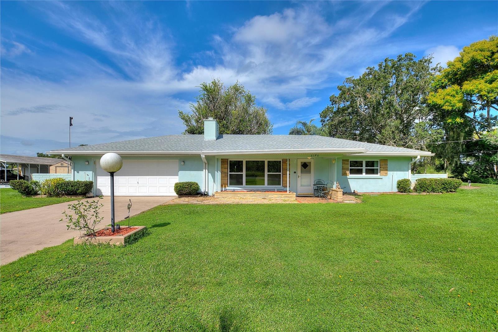 Don’t Miss This Canal-Front Charmer! Located in the desirable golf and lake community of Indian Lake Estates, this well-maintained home offers 2 bedrooms / 1 bath in the main house plus a full bath in the oversized garage. Nestled on a ½ acre canal-front lot with direct access to Lake Walk-In-Water, this property is perfect for those who love boating, fishing, and Florida sunsets....Updates include a new roof (April 2025) for added peace of mind and beautiful windows throughout that let the outside in!! Inside, the spacious floor plan features a large living room with a beautiful stone fireplace, creating a warm focal point. The kitchen provides ample cabinetry, counter space, cooktop, wall oven, and microwave. Just off the kitchen, the all-season Florida room is the perfect place to relax or entertain while enjoying tranquil water views...Outdoor living is easy here! Enjoy the enclosed patio with outdoor cooking space or head out back to the boathouse with electric lift for quick access to the lake....Indian Lake Estates is a unique community located about 20 miles east of Lake Wales and surrounding 7,500-acre Lake Walk-In-Water—nationally recognized for some of the best fishing in Florida. Community amenities include: 18 & 9-hole golf courses, Basketball & tennis courts, Playground, Beach, boat ramp, marina & pavilion with propane grills & picnic tables, 23,000 sq. ft. clubhouse with restaurant, fitness room, library, ballroom & pro shop...Wildlife lovers will enjoy frequent visits from deer, turkey, eagles, cranes, and more. Plus, you’re just an hour from Orlando & Disney, a little over an hour from Tampa, Busch Gardens, and Gulf beaches, and minutes to Bok Tower Gardens and Westgate River Ranch Resort & Rodeo...If you’ve been searching for a peaceful waterfront lifestyle with endless recreation, this is the one! Make your plans to preview this well-loved home and find out how great life can be at Indian Lake Estates!