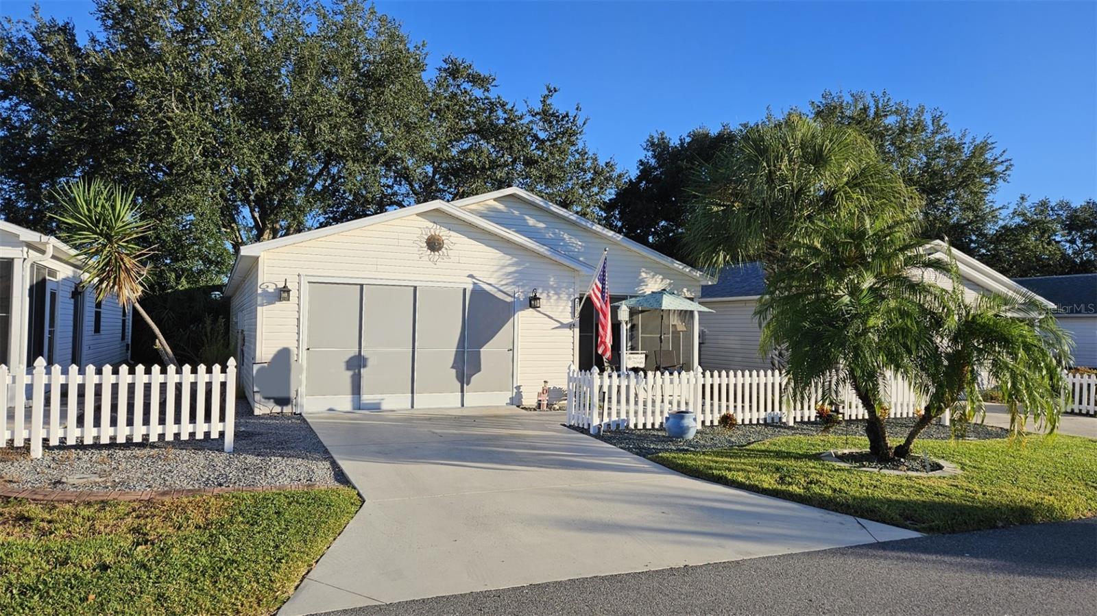 Must see beautifully updated 2/2 Patio Villa in the sought after Villa Vera Cruz area of The Villages with easy access to both the 441 and 466 travel corridors. This home sits on a nicely landscaped lot with no homes behind you. Enter into the spacious Tiled and Enclosed Lanai.The welcoming leaded front glass door opens to
an open concept floor plan. Be impressed with the remodeled Kitchen featuring Granite countertops, Tiled Backsplash, Soft Close White Cabinetry with pull out shelving and under mount lighting with remote. A Solar
Tube has also been recently added for extra natural light. Stainless Steel Appliances, including a new 2025 Refrigerator, complete this designer look! Separated by a breakfast bar is the Dining Room and Living Room
combo with new Laminate flooring and a newly Installed French Door that opens to your side Patio Area. The
Primary bedroom En Suite features a large walk In closet, Laminate floors, Tile floors in Bath, Large Vanity with Granite Top, and a Toilet and Walk In Shower Area with a door separating it from the Vanity area for a little
extra privacy if needed. The Guest Bath has Tile floors, and a Tub/Shower Combo. Vanity is also Granite.
The Guest Bed Room has an Installed Murphy Bed allowing usage as an Office when an extra sleeping area
is not needed. The Garage can accommodate one car plus your Golf Cart. Extras here include,2023 Garage door and opener, painted garage floor, New Irrigation control system, as well as added storage shelves, cabinets and work bench. An added bonus is the Attic Solar Fan allowing heated air to vent helping with your cooling costs. There are pull down stairs allowing access to this space. High cost Items have also been replaced: ROOF & Solar Tube 2019, HVAC 2024, Hot Water Heater 2023, Enclosed and Tiled LANAI 2020.
This is the one you've been searching for! Call for your private showing! NO BOND