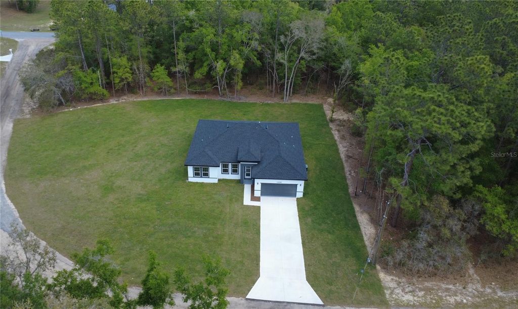 Photo of 10099 N Carib Way, Citrus Springs, FL 34434 (MLS # O6397077)