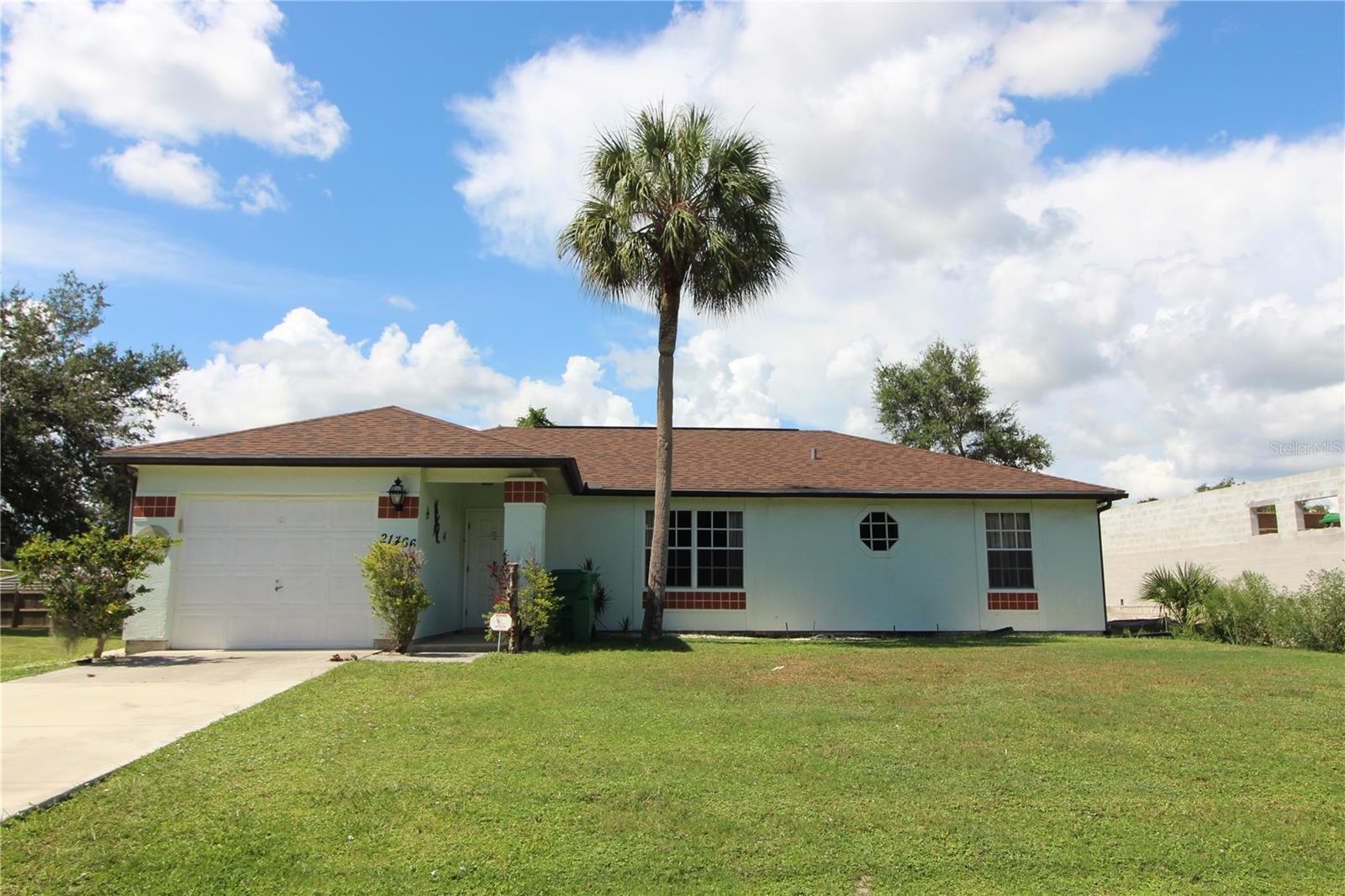 This move-in ready Port Charlotte pool home offers 3 bedrooms, 2 baths, wood floors throughout, a screened-in pool, and a spacious 40'x10' covered lanai. Recent updates include a new roof (2023), AC (2022), and complete plumbing re-pipe (2019). Ideally located near schools, shopping, and hospitals. Schedule a private tour today.