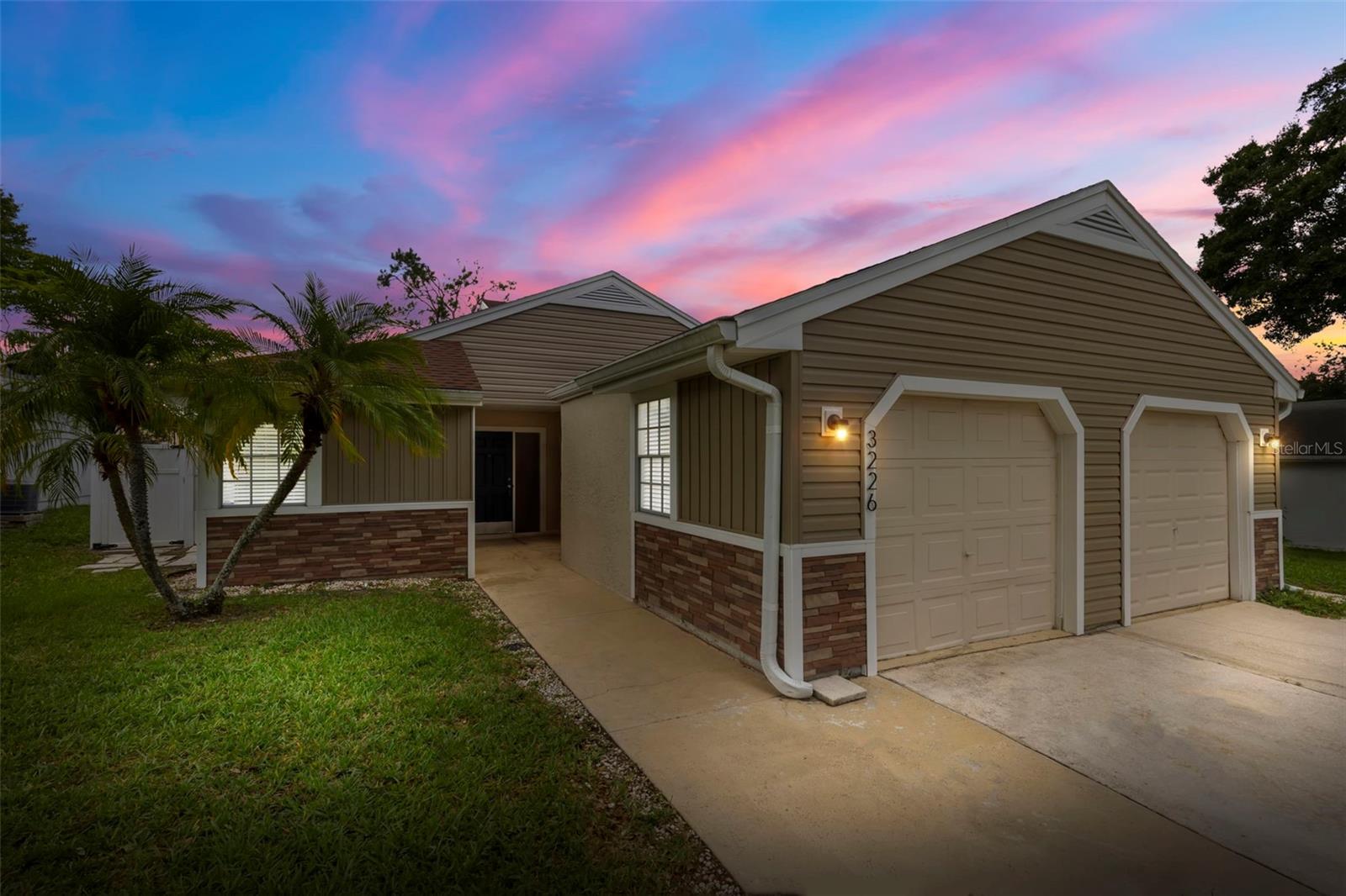UPDATED 3 BEDROOM VILLA! Welcome to 3226 CLOVERPLACE in beautiful Palm Harbor! This UPDATED 3-bedroom villa offers a perfect blend of style and convenience. The spacious kitchen boasts stainless steel appliances, granite countertops, and white shaker cabinets, seamlessly opening to the dining and family room. Recent updates include NEW SIDING AND SOFFITS in 2023, roof 2018, and AC in 2019. The inside utility room is conveniently located just off the kitchen and includes the full size washer and dryer. The family and dining room area features VAULTED CEILINGS, creating an open and light-filled ambiance and laminate plank flooring. Sliding doors off the family room lead to an enclosed patio and a door to the back deck area, providing access to the FENCED IN BACK YARD. The primary bedroom is equipped with a LARGE WALK IN CLOSET, an additional closet with built-ins for extra storage, laminate plank flooring and a slider to the enclosed porch. The UPDATED BATHROOM features a tub shower combo with modern tile, a designer mirror, and lighting, as well as a new vanity with ample storage space. The second bedroom boasts plank laminate flooring and two windows, allowing plenty of natural light. The garage has been converted to a 3rd bedroom but could also easily serve as a home office, den, or media room—the possibilities are endless. This home is move-in ready and waiting for you! Located in the much desired community of Cloverplace that includes a COMMUNITY POOL and is centrally located near shopping, restaurants, and just a short drive to Tampa or the beaches. Zoned for top rated schools including Palm Harbor University. No pets or smoking allowed.