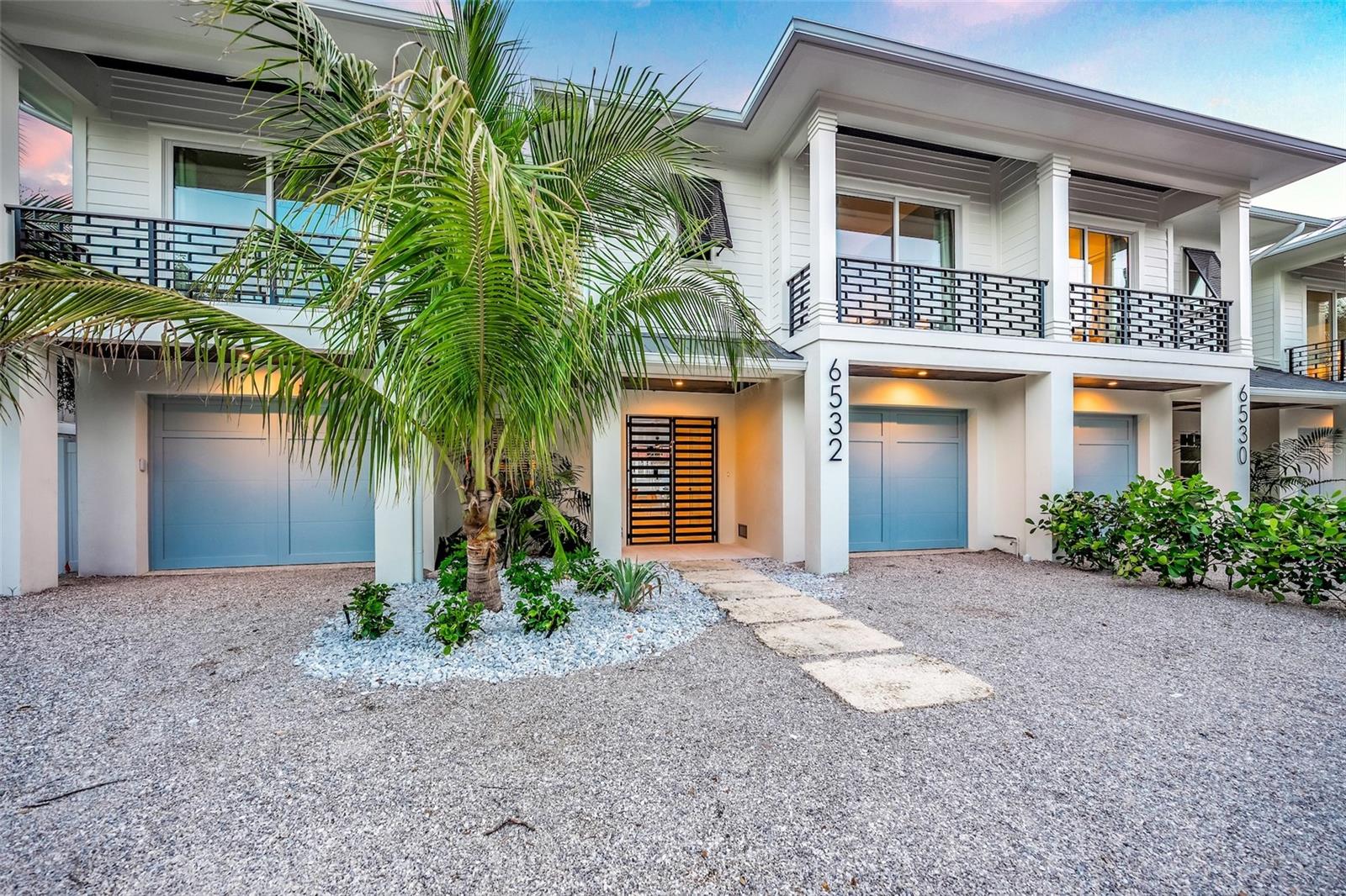 LOCATION, LOCATION, LOCATION ON BEAUTIFUL SIESTA KEY!!! Experience the ultimate in coastal luxury with this stunning new construction home by the renowned Eason Builders Group. Located on the tranquil and exclusive Peacock Road, this four-bedroom, four-and-a-half-bathroom waterfront residence offers a harmonious blend of modern elegance, tropical beauty, and thoughtful design. Be welcomed by sophistication as you enter the great room, where an open floor plan features inviting seating area and expansive sliding doors that bring the tropical breeze inside. The chef-inspired kitchen boasts top-of-the-line appliances, a generous center island, and a bar area with a wine fridge, creating the perfect space for entertaining or preparing gourmet meals. This home’s well-thought-out design includes four spacious bedrooms, each with its own en-suite bathroom adorned with designer finishes, ensuring comfort and privacy for every guest. This property is being offered turnkey furnished, allowing you to move in and start enjoying this exquisite home immediately or continue to use as a successful rental property. Outside, your personal paradise awaits. Surrounded by lush tropical landscaping and breathtaking water views, the outdoor living area features a sparkling pool with a water slide, an in-ground spa, and expansive patios perfect for hosting or relaxing. While part of an architecturally stunning paired estate, this home offers the independence and feel of a standalone residence- perfect for refined coastal living. Located in the heart of Siesta Key, this home offers the ultimate convenience. Just minutes from the renowned Siesta Key Beach—or less than a 10-minute walk—you can enjoy the powdery white sand and turquoise waters with ease. The home is also close to local restaurants, marinas, boutique shopping, and Sarasota’s vibrant arts and culture scene. Whether you’re seeking a serene personal retreat or a lucrative investment property with weekly rentals allowed, this home delivers it all. Don’t miss this rare opportunity to own a piece of paradise where luxury, breathtaking views, and the Siesta Key lifestyle come together to create your perfect coastal haven.