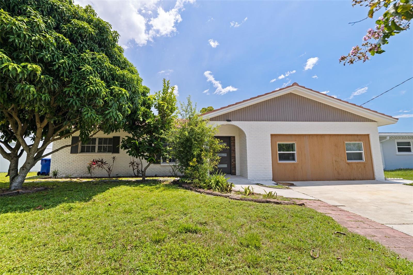 787 San Salvador isn’t just a house—it’s a lifestyle. From sunny mornings by the pool and room for every member of your household, this home captures the relaxed yet vibrant spirit of Dunedin. This fully renovated 4-bedroom, 3-bathroom pool home with over 2,000 square feet of interior space, is just five minutes from downtown Dunedin and located in a non-flood zone. This home has has been lovingly updated, including new luxury vinyl plank flooring throughout, fresh interior and exterior paint, and modern finishes that make it completely move-in ready. The layout is both functional and spacious, offering two en suite bedrooms, including a large primary suite with double closets. A generous family room with a stone-wall fireplace offers extra room to gather, while the open kitchen flows seamlessly into the dining and living spaces. Step through to the screened-in lanai with a brand-new flat roof and enjoy the Florida lifestyle in your private pool.
The home has been re-plumbed with PVC,has a 2019 HVAC, the panels were updated in 2019 and 2024, the tile roof has 15 years of useful life remaining, and a recent 4-point inspection was completed pre-listing for added peace of mind.
All of this is located just minutes from Dunedin’s vibrant downtown, where you’ll find locally owned restaurants, breweries, art festivals, waterfront parks, and access to the Pinellas Trail. This home combines size, style, and smart upgrades in one of Pinellas County’s most loved communities—without the flood zone limitations.