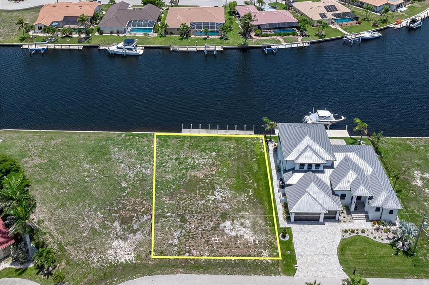 WATERFRONT LOT IN PGI W/SAILBOAT ACCESS & WIDE CANAL VIEW - This vacant, waterfront lot in Punta Gorda Isles has it all: a wide canal view for privacy, full seawall, existing 60ft concrete dock & quick sailboat access to Charlotte Harbor via Buckley's Pass. OR exit the canals via Ponce Outlet after a leisurely trip around the perimeter canal. Lot dimensions for the property are 80x120x80x120 w/80ft of seawall. Build your dream home here & start enjoying some of the best fishing & boating in SW Florida from your backyard. Lot is surrounded by a mix of older & newer, custom-built homes - add your custom home to the mix. City water & sewer available. Located near St Andrew's South Golf Course, you can enjoy a round in the morning and still head out for dinner by boat. Enjoy colorful sunrises over the canal thanks to the eastern rear exposure. Own your piece of paradise today.