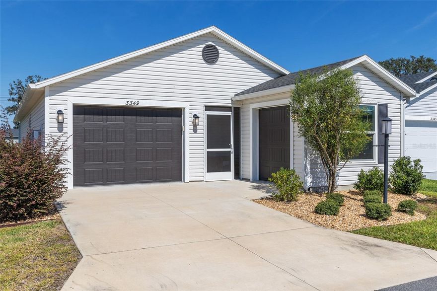 Like-new Moonstone COURTYARD VILLA in the Village of Deluna! This bright and cheerful 2-BEDROOM, 2-BATH home offers an OPEN FLOOR PLAN with HIGH CEILINGS and abundant NATURAL LIGHT. Low maintenance vinyl flooring through living room, dining room and kitchen.  The spacious kitchen features WHITE CABINETRY with TONS OF STORAGE, a PREP ISLAND, STAINLESS STEEL APPLIANCES, and GRANITE-LOOK COUNTERTOPS. The inviting living and dining areas flow to the COVERED, SCREENED FRONT LANAI—perfect for MORNING COFFEE, even¬ing relaxation, or meeting friendly neighbors. The PRIMARY BEDROOM boasts TRAY CEILINGS and generous space for rest and retreat, while the EN-SUITE BATHROOM offers a WALK-IN SHOWER, DUAL SINK VANITY, and PRIVATE WATER CLOSET. The split-bedroom design provides PRIVACY for guests, and the INDOOR LAUNDRY adds convenience. You’ll appreciate the 1½-CAR GARAGE plus a SEPARATE GOLF CART GARAGE for easy Villages transportation.. Fantastic location—an easy golf cart ride to Brownwood Paddock Square and just 10 minutes to Magnolia Plaza with PUBLIX, CVS, RESTAURANTS, and SHOPS. Enjoy sunny afternoons at EDNA’S on the Green or take advantage of nearby Deluna amenities including PICKLEBALL, TENNIS, RECREATION CENTER, and COMMUNITY POOL.  Built in 2022, the ROOF, HVAC, and WATER HEATER are all like new Ideal for a budget-conscious retiree, investor, or anyone eager to experience The Villages lifestyle at a smart value!