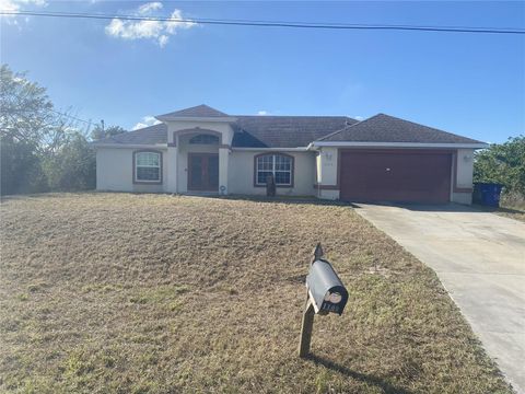 Photo of 1109 Chaplin Avenue, Lehigh Acres, FL 33971 (MLS # TB8417509)
