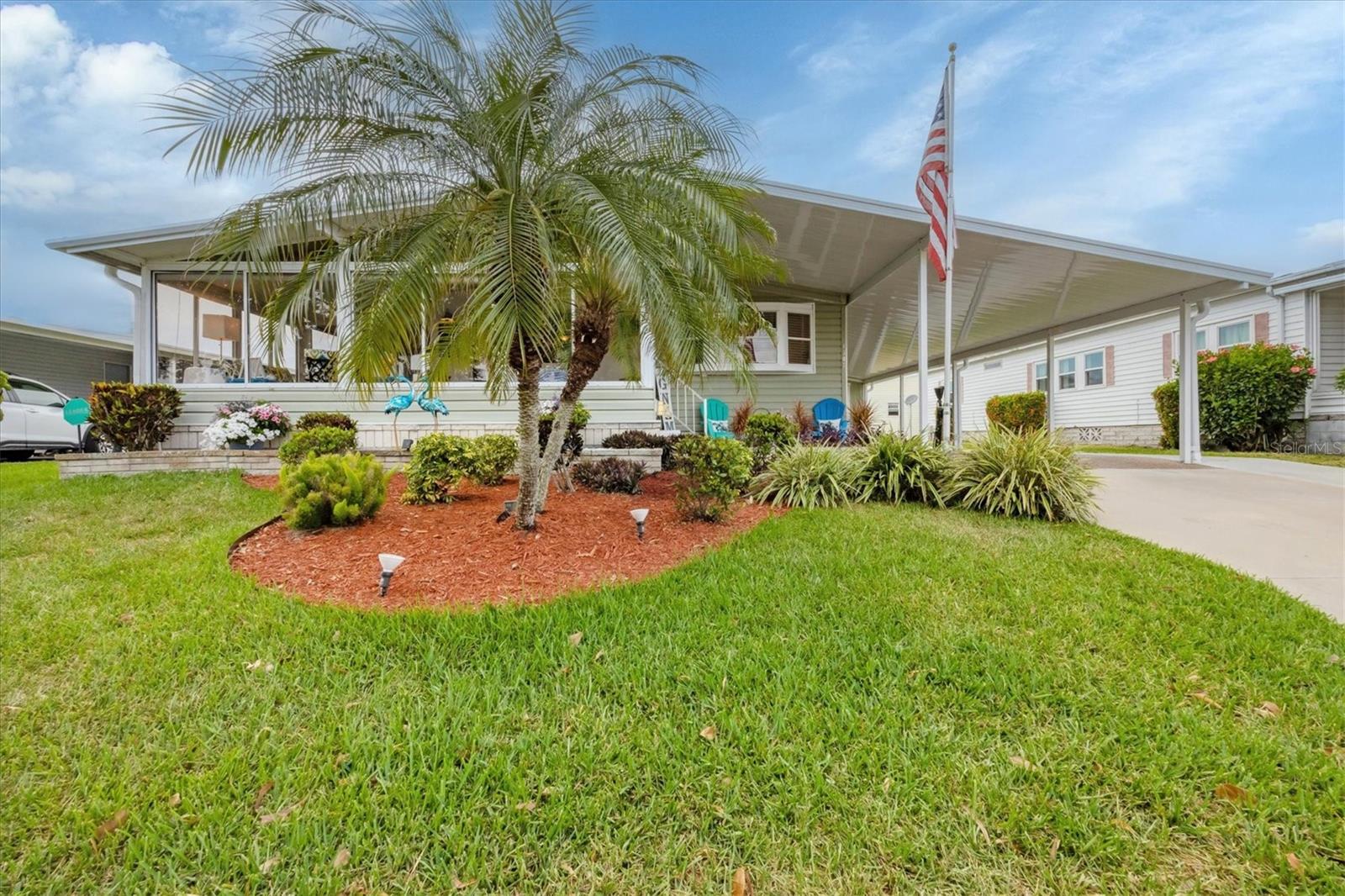 Welcome to Tidevue Estates, an active 55+ community where LAND IS OWNED and ready for you to move in! This turn-key furnished home has a BRAND NEW METAL ROOF installed in March 2025. Enjoy the comfortable Florida Room with laminate flooring, glass windows, and vaulted ceiling. Easy access from the Florida Room to the screened lanai makes it perfect for outdoor barbecuing and enjoying the Florida weather. The home features Wayne's Coating and laminate flooring throughout. The updated kitchen is a cook's dream, equipped with a French door refrigerator, smooth top stove, built-in microwave, farm sink with glass tile backsplash on countertop, granite countertops, and neutral-colored cabinetry. The spacious primary bedroom includes two wardrobe closets and a built-in dresser. The en-suite bathroom has a walk-in shower and updated single sink vanity. The laundry room is conveniently located in the Tuff Shed, which also offers space for a workshop and storage. The carport includes an added sidewalk, providing the perfect place to park your golf cart. Plus, the open front porch is a great spot to greet friends as they pass by. Low HOA of only $600 annually. Pets are not permitted. Plenty of activities to keep you busy in this community. Take a water aerobics class in the solar-heated community pool, or work on your tan. The community library has free WI-FI connection. Updated fitness center. Meet friends and make new ones for a game of indoor pickle ball, bocce ball, or shuffleboard. Join the Golf League. Take a bike or golf cart ride to Veterans Park to watch the wildlife and enjoy the sunset. Ellenton Premium Outlet Mall, restaurants, and medical facility's just minutes away. Easy access to I-75. Explore Sarasota and visit University Town Center Mall, St. Armand's Circle, Selby Botanical Gardens, and the Ringling Mansion & Museum. Not to mention a short drive to our beautiful Gulf Beaches.