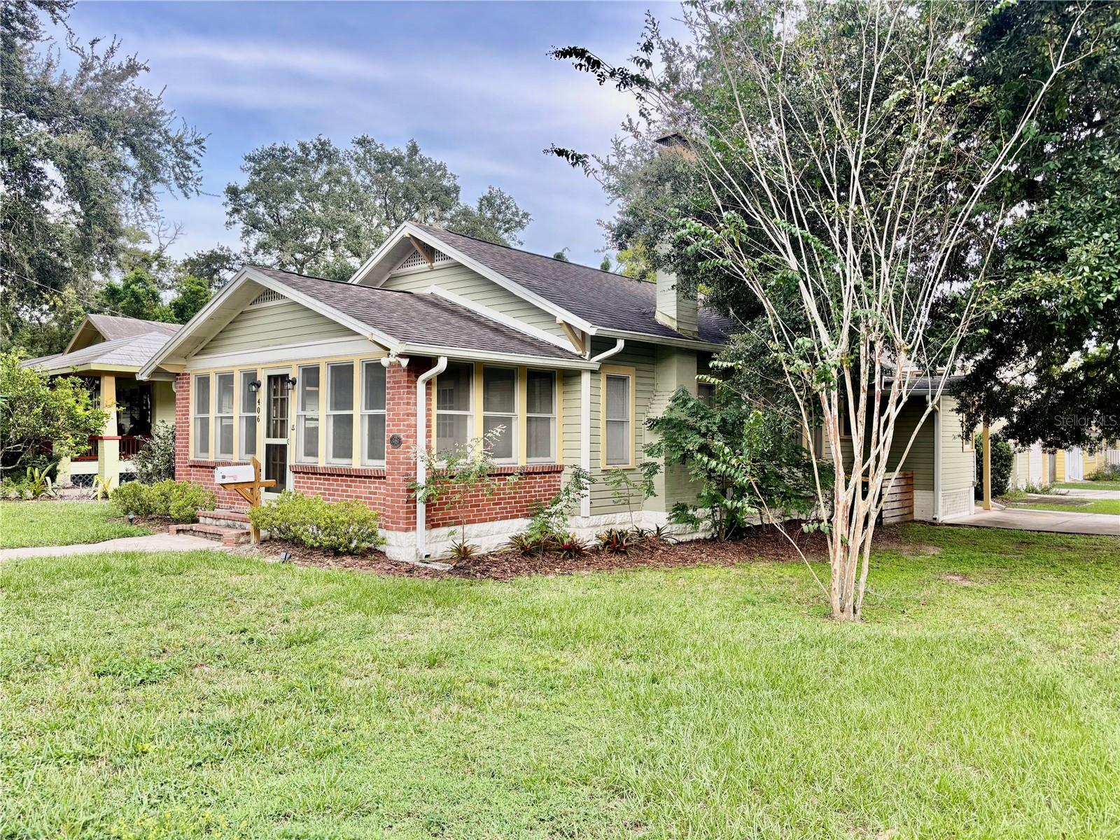 Step back in time and experience the charm of this beautifully preserved historic home, ideally located in the heart of downtown Mount Dora. Built over 100 years ago, this one-of-a-kind residence features original wood floors, a cozy wood-burning fireplace, and timeless character throughout.This spacious two-bedroom, two-bathroom home offers large walk-in closets in each bedroom, a full kitchen, a bright Florida room, and a large living room filled with natural light. The quiet corner lot provides a peaceful setting, complete with a private courtyard perfect for relaxing or entertaining.Enjoy the convenience of being just a short walk to downtown Mount Dora’s shops, restaurants, festivals, and waterfront activities. This home combines historic charm with modern living, making it the perfect retreat in one of Central Florida’s most desirable locations. Don’t miss this rare opportunity to live steps from everything Mount Dora has to offer while enjoying the character and beauty of a century-old home. Lawn care included.