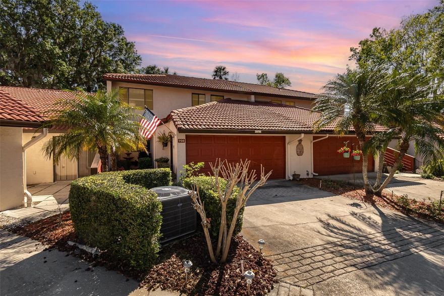 Welcome to your dream townhouse in the serene Waterwood community! This beautiful 3-bedroom, 2.5-bathroom home offers the perfect blend of comfort, convenience, and charm. Upon entering, you'll immediately be drawn to the thoughtfully designed floor plan, ideal for both everyday living and entertaining. The spacious family room boasts a wood-burning fireplace, vaulted ceilings, and sliding doors leading to the outdoor patio to enjoy the peaceful ambiance, complete with the soothing sounds of birds chirping and to simply enjoy the tranquility. Just off the dining room, you'll find the bright interior sunroom, which floods the space with natural light and adds extra square footage to the living area. The light-filled kitchen is designed for family and friends, featuring solid wood cabinetry, beautiful quartz countertops, and a pass-through overlooking the dining area. The spacious primary bedroom is a true retreat, featuring an ensuite with a walk-in shower, granite countertops with dual sinks, and additional space is perfect for a home office or an inviting spot to unwind with your favorite book.  The other 2 bedrooms are well-appointed, with a guest bathroom just steps away and is complete with a tub/shower combo and single sink. The home's interior laundry room is conveniently located just inside the 2-car garage, offering added convenience. For boating enthusiasts, you'll love the easy access to the Harris Chain of Lakes, whether it's a quick boat ride to a waterfront restaurant or enjoying the stunning fireworks from the comfort of your boat, this home truly embraces lakeside living. The Waterwood community offers exceptional amenities, including a clubhouse, library, boat ramp, heated pool, fire pit, fishing pier, and boat and RV storage areas. The HOA fee includes private sewer, water services, and lawn care, there's an additional fee for the boat slips and space in the storage yard. Experience a lifestyle where modern convenience meets the tranquility of a tropical retreat. Schedule your private showing today and discover why Waterwood is more than just a place to live—it’s a true escape!