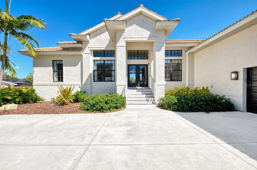 DON'T MISS THIS BOATER'S PARADISE!! Welcome to your private waterfront retreat, where relaxed luxury meets the best of Florida living. With deep-water canal access to the Gulf, premium finishes throughout, and true walkability to restaurants, pickleball, and kayaking, this home delivers a rare combination of lifestyle and location. Inside, the home is anchored by an enormous chef’s kitchen featuring a massive mitered-edge island, expansive counter space, and seamless connection to the living and dining areas. The open layout is exceptional for entertaining, while the modern electric fireplace adds warmth and a refined focal point to the main living space. Out back, enjoy your private dock on a deep-water canal just one mile from the Gulf—great for boating, fishing, jet skis, or launching kayaks from your own backyard. The fenced yard is finished with premium artificial turf and lush landscaping, offering year-round beauty with minimal maintenance. The home is already pool-ready and includes engineered plans and a full 3D rendering for a luxury pool—saving months of planning time and thousands in design costs. Set on a quiet private road with no through traffic and a county park directly across the street, the setting is both peaceful and exceptionally convenient: • Walk to three different tiki bars, waterfront restaurants, and shopping • 3-minute walk to tennis and pickleball courts • Direct bike access to the Legacy Trail • No HOA • High elevation so No flood damage from recent hurricanes A rare waterfront opportunity offering privacy, walkability, and immediate Gulf access.  Call and schedule your private showing today!!