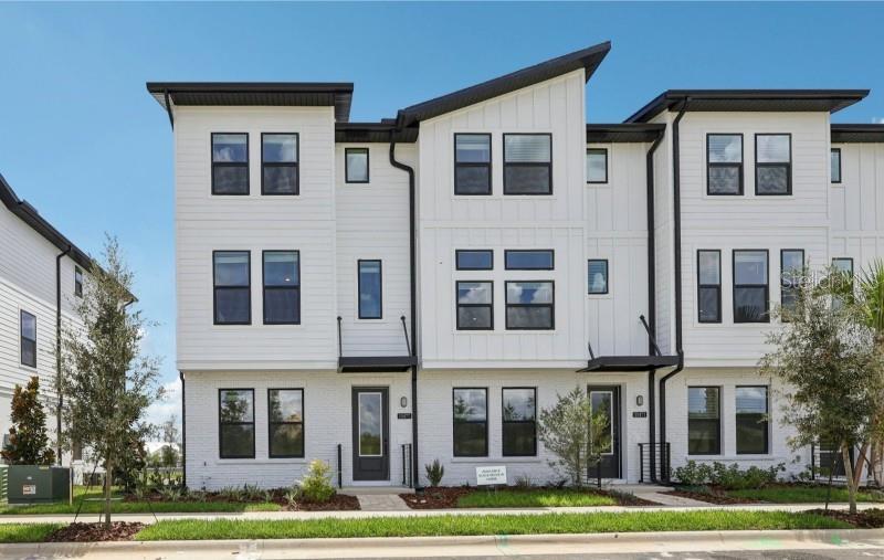 Receive up to $20,000 in closing costs! Welcome to this stunning 3-story townhome by Ashton Woods, part of the sought-after Coastal Collection in Parkview at Hamlin. Thoughtfully designed with 3 private suites, this home offers flexibility and privacy for family and guests alike. The first-floor suite is perfect for visitors or a home office, while the third-floor primary suite features a spacious layout with a walk-in closet and spa-inspired bath. The heart of the home is on the second floor, where the open-concept living room, dining area, and kitchen flow seamlessly together. The chef’s kitchen boasts 42" cabinetry, stainless steel GE appliances, white quartz countertops, a large island, and vinyl plank flooring, all opening to a covered lanai for indoor-outdoor living. Additional bedrooms provide plenty of space for comfort and versatility. Located in the vibrant Parkview at Hamlin community, residents enjoy resort-style amenities, access to top-rated schools, and close proximity to shopping, dining, and all that Winter Garden has to offer.