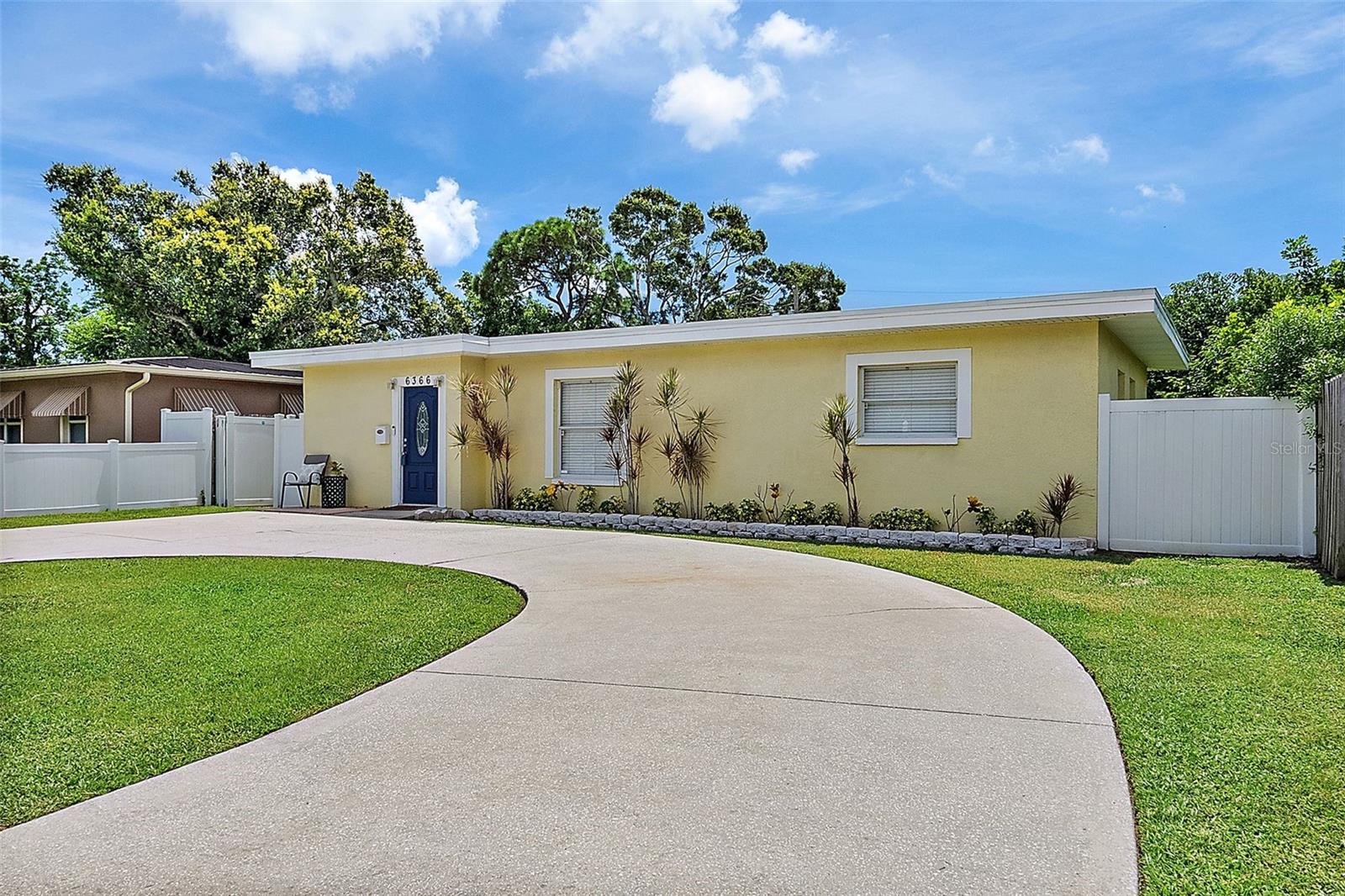 Move in ready updated 3/2 block constructed home for under $320k! Flood zone X and evacuation zone D. This home did NOT flood or have any damage in last year's storms! New TPO membrane roof in 2019 that includes a transferable warranty. Split bedroom plan for added privacy. Open kitchen with granite counters, gorgeous wood cabinetry, and stainless steel appliances. New luxury vinyl floors in living room and bedrooms with tile in the kitchen and baths. Inside laundry closet with new (2024) stackable washer/dryer. Home is equipped with an ADT security system, window & door sensors, camera, and ring-doorbell. Large circular driveway. Deep 130ft lot with a fenced yard, a storage shed, and plenty of room for a pool. Located just outside of Holiday Park in Miles Pines, this home is close to tons of outdoor recreation and indoor fun! 10-15 min drive to pristine Gulf beaches, 15-20 min drive to Downtown St. Pete, about 30 min drive to Tampa International Airport. Minutes to restaurants, shopping, Tyrone Mall, Northwest Recreation Center (ball fields, pool, tennis courts, community classes...) This home is a must see! Buyer to verify all information. Measurements are approximate ans should be verified.
