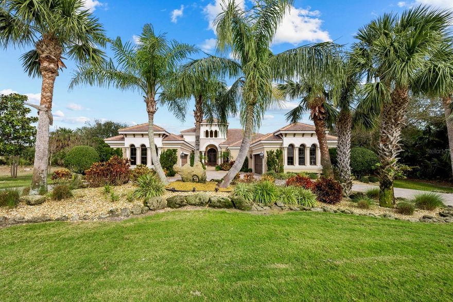 Waterfront Luxury Meets Mediterranean Charm – 121 Island Estates Parkway.  Prepare to be captivated by the elegance and comfort of this Mediterranean-inspired masterpiece.  Located on 1.5 acres, along the Fox Cut leading to the Intracoastal Waterway, this 4,507 sq ft Ruttenburg-built estate offers an unparalleled blend of luxury and functionality.  From the grand columns flanking the front entrance, circular driveway and the oversized 4-car garage, every detail of this home has been thoughtfully crafted.  Inside, the open/split floor plan features soaring tray ceilings with custom paint techniques, faux-painted walls, and a custom living room fireplace. The gourmet kitchen is a chef’s delight, boasting Wolf stainless appliances, a gas cooktop/grill, ample solid wood cabinetry, stone counters, center island, multiple dishwashers and sinks.  The adjoining wet bar and wine storage closet ensures you’re always ready to entertain. Retreat to the luxurious primary suite, where a large sitting area sets the mood for relaxation. The spacious en-suite bath, with a wall fireplace provides a spa-like experience, while direct access to the private outdoor courtard with fountain invites several hours of sun bathing.  A separate in-law suite with private entry offers comfort and privacy for guests or family members. A dedicated wonderful study with hardwood flooring completes the well-designed layout.  Step outside to the expansive lanai featuring a gas fireplace, a summer kitchen, and a half bath—perfect for hosting friends and family.  Cool off in the saltwater heated pool and spa or head to the Intracoastal Waterway in your boat, kept in the covered boathouse on a lift. You can also wash off your trip to the beach under the outside shower.  Modern conveniences abound, including a Marantz surround movie system, and a Sonos whole-house multi 10 zone sound system.  The home also features two A/C heat pumps replaced in 2021, a tankless water heater, whole-house generator and security system for peace of mind.  Other features include solid core doors throughout, custom window treatments/blinds, crown molding, impact glass windows, sliding door system which opens up family room, kitchen, breakfast nook to lanai, wall built in units, central vacuum system, built in wall safe, kitchen water filtration system and much more.  Embrace the Florida active lifestyle with access to golf, tennis, and miles of walking and biking trails.  Plus, you’re conveniently close to the ocean, St. Augustine, Daytona Beach, and Jacksonville and a short distance to the Island Estates community’s private beach.  This is more than a home—it’s a lifestyle. Don’t miss your chance to experience it firsthand. Schedule your private tour today!