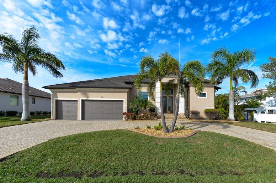 CUSTOM BUILT FULLY FURNISHED WATERFRONT HOME ON EXTRA LARGE VIVANTE LAKE LOT IN BEAUTIFUL PUNTA GORDA ISLES!  Drammatic double door entry with double retractable screens for maximum fresh air flow. Beautifully appointed great room style open floorplan home with 14' high coffered ceiling, 8' doors, and 10' zero corner sliding glass doors opening to a beautiful lake view. Porcelain tile plank flooring everywhere except den and primary bedroom which are quality hard wood composite. Large open kitchen with 42' wood cabinets, granite counters, breakfast bar, pantry closet and more. Formal dining room overlooks waterfront. Primary bedroom with 2 walk-in closets and en-suite bath featuring walk through double shower, dual sinks, soaking tub, and private commode closet. Third bedroom features an en-suite bath with walk-in shower and pool access. Large double door den off entry foyer. Inside laundry room with sink and cabinets. The exterior features a double lanai with pavers: Large 33 x 9 area with outdoor kitchen and grill and a second 22 x 12 area that adds to the expansive outdoor lakefront entertaining area which includes a large, heated saline pool with pebble tech type surface all within a new screened enclosure featuring ultraview screening for wide, unobstructed water views. Other features include dual entertainment systems (lanai and den) with built-in speakers, electric roll down see-through Kevlar type storm curtains, new metal tile roof, and brand-new A/C. Quiet, non-through street just a half mile to Ponce De Leon Park with a beautiful small beach and boat launch. 5 minutes to Isles Yacht Club, Fishermen’s Village, and downtown historic Punta Gorda with community events and entertainment. AREA INFO: Downtown Punta Gorda is located on the Gulf Coast of Southwest Florida, approximately 2 miles west of 1-75 off Exit 164 and features EASY ACCESS TO WORLD CLASS FISHING IN CHARLOTTE HARBOR AND THE GULF OF AMERICA. By sea, Punta Gorda is located on Charlotte Harbor about 30 minutes by water from Port Boca Grande and Boca Grande Pass known as the Tarpon Fishing capital of the world. Punta Gorda features historic Fisherman's Village with its many shops, galleries, boutiques, restaurants and a museum. The charming downtown area of Punta Gorda features quaint cafes, restaurants, and art galleries. There are many public and semi-private golf courses within the greater Port Charlotte/Punta Gorda area which is conveniently and quietly located approximately 50 miles south of Sarasota, 24 miles north of Fort Myers, 125 miles from Orlando and Disney World, approximately 40 minutes to the Southwest Florida International Airport, and only 15 minutes to Punta Gorda Airport.