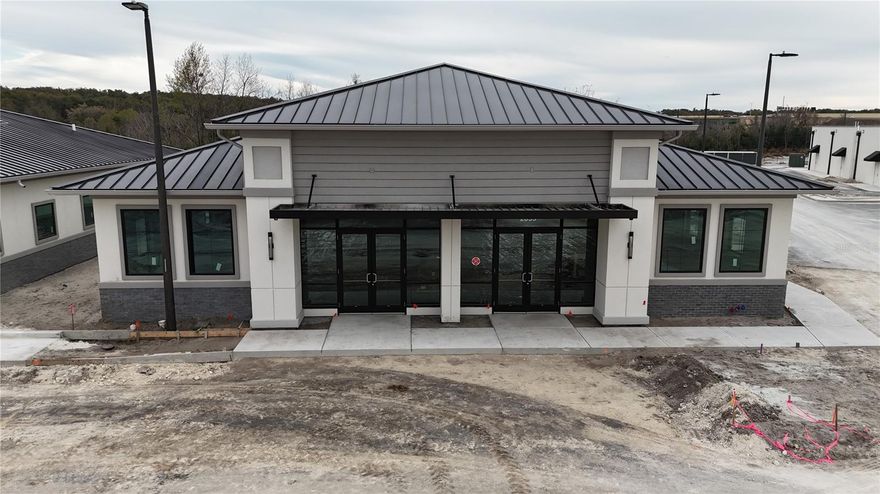 Under Construction. Building #13 is available for purchase at Lake Carter Exchange, a distinguished mixed-use development in Apopka’s East Shore at the intersection of Ocoee-Apopka Road and W Keene Road. This dark gray shell building is ideal for medical or professional offices, with potential for retail use based on buyer needs. The shell delivery offers full flexibility for custom interior design with two front entrances supporting up to two unique suites. The development is strategically located less than one mile from Advent Health’s seven-story, 120-bed hospital and opposite a new Publix Supermarket development. Situated in the vibrant East Shore trade area, which includes 5,000 planned residences and an average household income above $100k, this Class A property is perfectly positioned for businesses targeting growth in Central Florida’s second-fastest-growing city. Contact us for pricing details/incentives and to schedule a tour of this exceptional commercial opportunity.