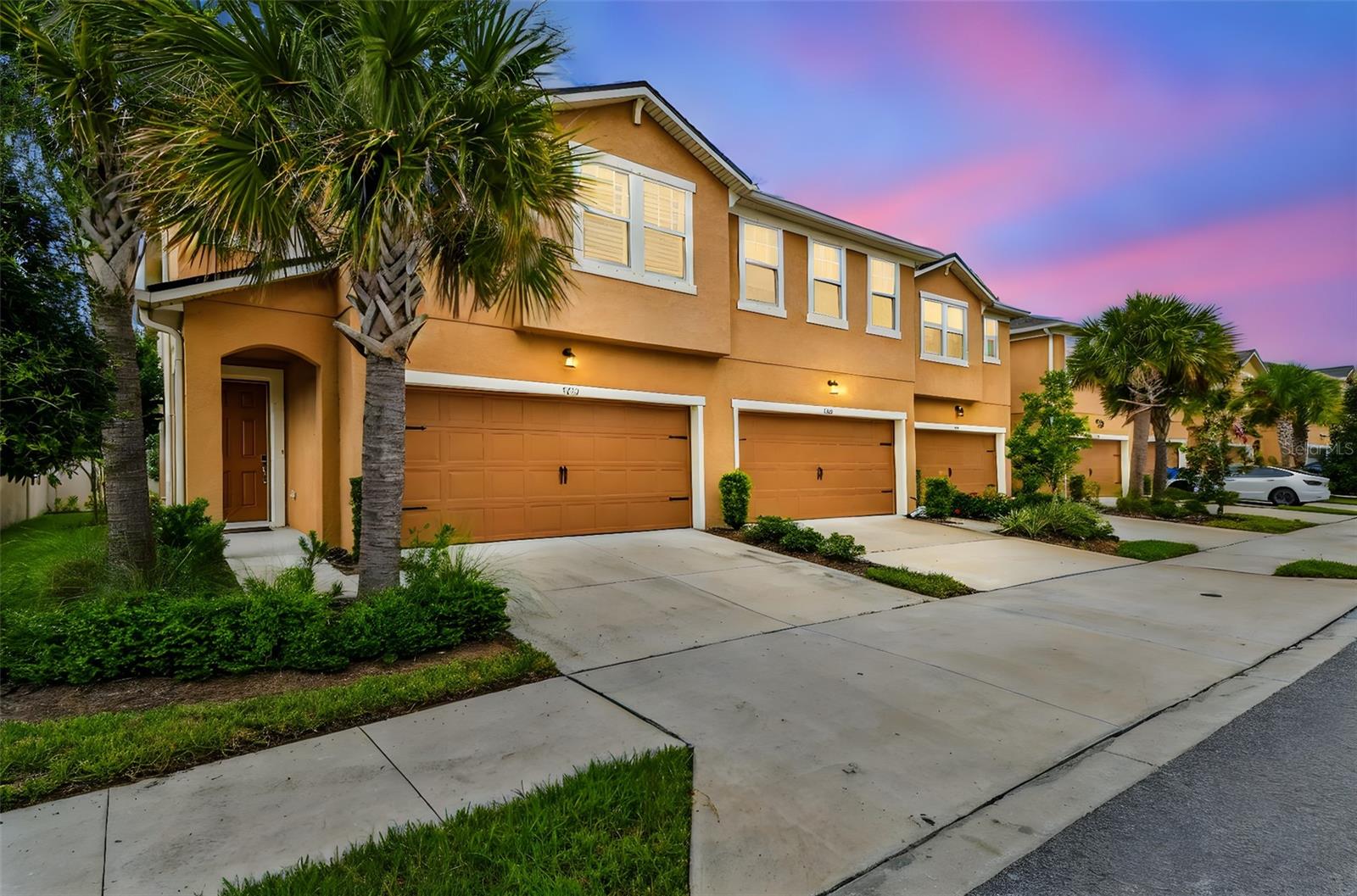 Welcome to this PREMIUM CORNER LOT end-unit townhome, tucked inside a GATED COMMUNITY in the heart of LUTZ! Offering both privacy and convenience, this home sits within one of Tampa Bay’s most desirable school zones, making it a standout choice for families. The thoughtful layout features an OPEN, BRIGHT design with plenty of NATURAL LIGHT and durable TILE flooring throughout the main living areas. On the first floor, a full bedroom and bathroom provide flexibility—ideal for overnight guests, a home office, or multigenerational living. Upstairs, the owner’s suite is a true retreat with a TRAY CEILING, WALK-IN CLOSET, and a spa-like bathroom complete with DUAL VANITIES, a relaxing GARDEN TUB, and an OVERSIZED WALK-IN SHOWER. Two additional bedrooms, each with WALK-IN CLOSETS, share a well-appointed full bathroom. A versatile LOFT offers even more living space—perfect for a playroom, media center, or home gym. The stylish kitchen brings everyone together, featuring WHITE CABINETRY, GRANITE COUNTERTOPS, a SUBWAY TILE BACKSPLASH, an oversized ISLAND with seating, modern PENDANT LIGHTS, and a newly added BUTLER’S PANTRY. Thoughtful details include under- and over-cabinet lighting for a warm ambiance and an upscale French-door refrigerator that elevates the space. Recent upgrades continue throughout the home, including ceiling fans on both floors, built-in shutters on all windows, utility room cabinetry, and an upscale washer and dryer. Step outside to enjoy the SCREENED-IN LANAI with paver flooring, where you’ll appreciate having no side or rear neighbors. Plus, the WATER SOFTENER has already been FULLY PAID OFF—a valuable bonus for the next owner. LOW HOA fees cover WATER, SEWER, and TRASH. Community perks include a heated resort-style pool, outdoor kitchen with a grill pavilion, and a recently built playground—all just a short walk from your front door. Perfectly positioned near Dale Mabry Highway and the Veterans Expressway, this home offers quick access to shopping, dining, recreation, and all that Tampa Bay has to offer. Don’t wait—homes like this don’t come up often. Schedule your private showing today and experience the best of Lutz living!