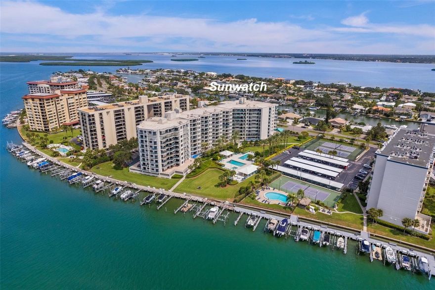 Welcome to Sunwatch on Island Estates in beautiful Clearwater Beach! A waterfront oasis with resort-style amenities yet only 96 units. This contemporary renovated open concept, split floorplan is three bedrooms, plus a den, two and a half baths and is the most desirable floor plan in the building. The designer finishes elevate this home with custom reclaimed wood accent walls, tile flooring and quartz and granite surfaces throughout. The kitchen has granite counters with a stunning waterfall edge island, solid wood cabinets with soft close drawers. Plantation shutters open to beautiful views from the owner’s suite with two balconies. The large ensuite bathroom offers dual quartz vanities, a free-standing tub, walk-in shower with a built-in bench. and a custom walk-in closet with a second walk-in closet in a guest bedroom. The den allows for a home office, TV room or other flex space without sacrificing a bedroom. The outdoor square footage, with three balconies, is perfect for outdoor dining, watching the sunrise, working from home, or relaxing. Three doors access the expansive main balcony from the living space with intercoastal views. The guest bedrooms enjoy a private large wrap around balcony also overlooking the intracoastal. The complex has two guest suites, tennis courts, pickleball, party room, fitness room, billiards room, two pools, heated spa, covered pavilions, large pool deck, two gas grills, beautifully landscaped common areas, under building gated assigned parking, bicycle racks, two elevators and a secured entrance. Association is fully funded and well run.  Property painted in 2024, roof 2024. Milestone Survey Completed. Structural Integrity Study Completed. Walk, bike or take the trolley to beautiful Clearwater Beach. The onsite marina often has boat slips for sale or rent. Come live or vacation on the Island and enjoy paradise!
