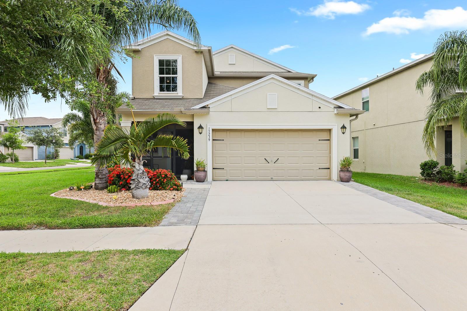 Welcome to this generously sized home located in the vibrant community of Vista Palms in Wimauma, Florida. Offering 5 bedrooms, 2.5 bathrooms, a spacious loft/flex area, and a 2-car garage, this home provides ample room for comfortable everyday living as well as entertaining. The first floor showcases an open-concept layout that seamlessly connects the kitchen, dining, and living spaces. The expansive living room is filled with natural light and features sliding glass doors that open to the fully fenced backyard—perfect for outdoor enjoyment and complete with a handy storage shed for added convenience and playground (can convey with the sale).
The kitchen is the heart of the home and is both functional and stylish. It features a center island ideal for meal prep and casual dining and a farmhouse-style sink that was recently installed, and a walk-in pantry for abundant storage. Appliances were updated in April 2022, and the dishwasher was just replaced in March 2025, offering modern reliability. The adjacent dinette space is perfectly positioned for everyday meals and gatherings.
The primary bedroom is thoughtfully located on the first floor, offering a private retreat from the secondary bedrooms upstairs. It features newly installed laminate flooring for a fresh, updated look, and a spacious walk-in closet finished with ceramic tile flooring. The en-suite bathroom offers a dual sink vanity, a large walk-in shower, and a private water closet for added comfort.
Upstairs, you’ll find a generous loft or flex space that can be tailored to your needs—whether it be a home office, play area, or second living room. Four additional bedrooms are located on the second floor, each with cozy carpet flooring and access to the second full bathroom.
Additional upgrades throughout the home include updated lighting fixtures that enhance the home’s ambiance, a water softener that’s less than one year old, and a washer and dryer set—also less than one year old—that convey with the sale. The exterior of the home offers an extended driveway, providing extra parking space for guests or multiple vehicles.
Vista Palms is a welcoming community that offers a variety of amenities, including a refreshing community pool with splash pad, a playground, and seasonal events that bring neighbors together. Conveniently located with easy access to Hwy 301, Sun City Boulevard, and I-75, this home offers a smooth commute in any direction and is close to an array of shopping, dining, and everyday conveniences.