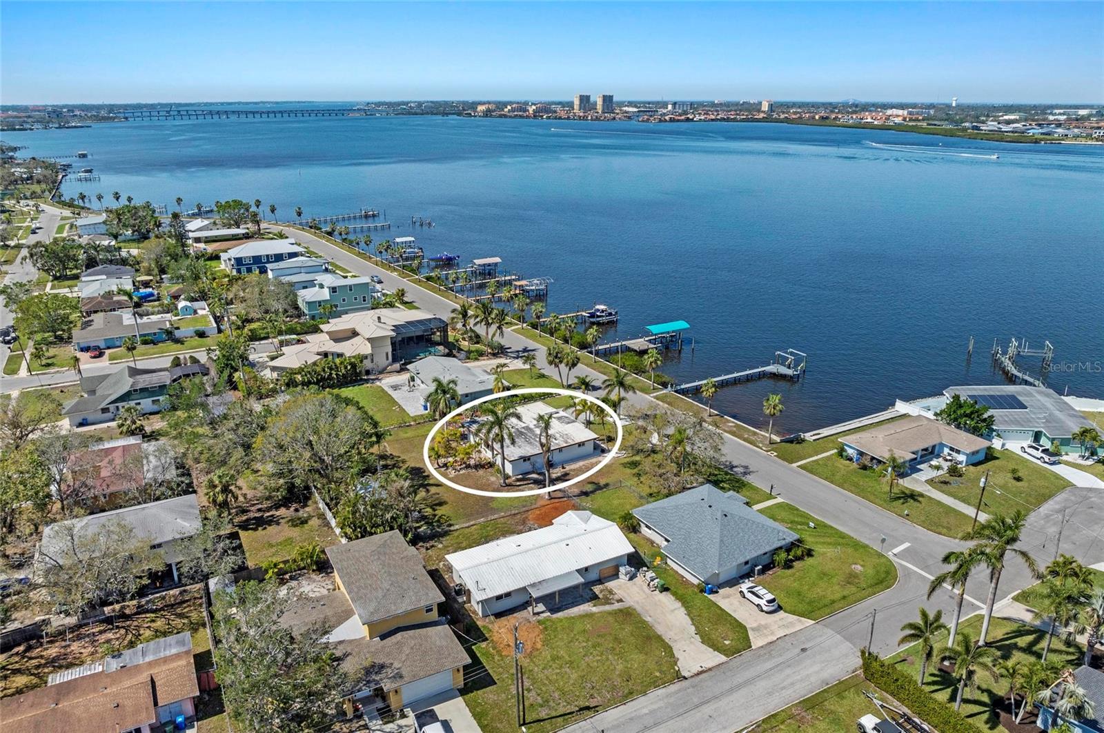 Waterfront Paradise Awaits on the Manatee River! Seize this rare opportunity to own your very own waterfront sanctuary along the highly desired Riverside Drive! This beautifully renovated 2-bedroom, 2-bath home sits on an expansive .439-acre double lot, perfectly positioned to capture mesmerizing sunset views over the open waters of the Manatee River. Boasting direct, bridge-free access to Tampa Bay and the Gulf of Mexico, this property is an absolute dream for boating enthusiasts, complete with your own private dock and boat lift. Step inside to experience coastal elegance blended seamlessly with classic Florida charm. Polished terrazzo floors flow throughout, complemented by inviting wood plank ceilings in the living area that add warmth and character. Expansive front windows frame the breathtaking waterfront vistas, creating a serene and inviting ambiance. The newly renovated kitchen is the heart of the home, perfectly blending modern style with coastal charm. It features sleek contemporary cabinetry, pristine quartz countertops, stainless steel appliances, and an eye-catching tile backsplash - ideal for hosting friends and family in style. The thoughtfully designed open floor plan enhances indoor-outdoor living, perfectly embracing Florida's renowned waterfront lifestyle. Outside, endless possibilities await on this generously sized, unrestricted double lot. Imagine your dream pool, create your outdoor oasis, store your RV, or bring along your favorite water toys - there’s fantastic space and room for future improvements. With no HOA or deed restrictions, this property offers unmatched flexibility and potential. Minutes from pristine beaches, enjoy island hopping, waterfront dining, world-class fishing, and limitless adventures on the water. Properties like this in one of the area's most desirable locations rarely come to market. Don't miss your chance - schedule your private showing today and begin your waterfront lifestyle!