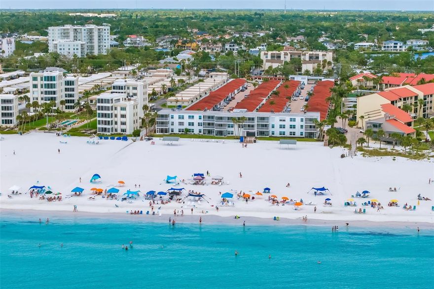 Tucked along the sugar-white sands of world-renowned Siesta Key, this freestanding villa offers the rare combination of effortless ownership, strong rental potential, and immediate coastal enjoyment. With direct beach access just steps away, every day begins and ends with the Gulf as your backdrop. Thoughtfully and completely updated, the residence features easy-care terrazzo flooring, a beautifully renovated kitchen with stainless appliances and dining space, along with a refreshed full bath and convenient half bath. The screened porch invites year-round indoor-outdoor living, while an impact-rated sliding glass door enhances both comfort and peace of mind. Positioned just steps from the community pool and clubhouse, this villa is part of an active, well-managed rental community offering flexible 5–7 day minimum rentals, making it an exceptional opportunity for those seeking income potential with personal-use flexibility. On-site management simplifies ownership, whether you’re local or remote. Sold furnished, the home is ready for immediate enjoyment or rental—just bring your suitcase. Parking is conveniently located directly in front of the unit. Beyond the property, you’re ideally situated near Siesta Key’s popular dining, shopping, and parks, while still enjoying a quieter stretch of beach perfect for morning walks, sunset swims, and relaxed days on the sand. Whether you’re looking for a smart investment, a personal retreat, or the perfect blend of both—this villa delivers the Siesta Key lifestyle with ease.