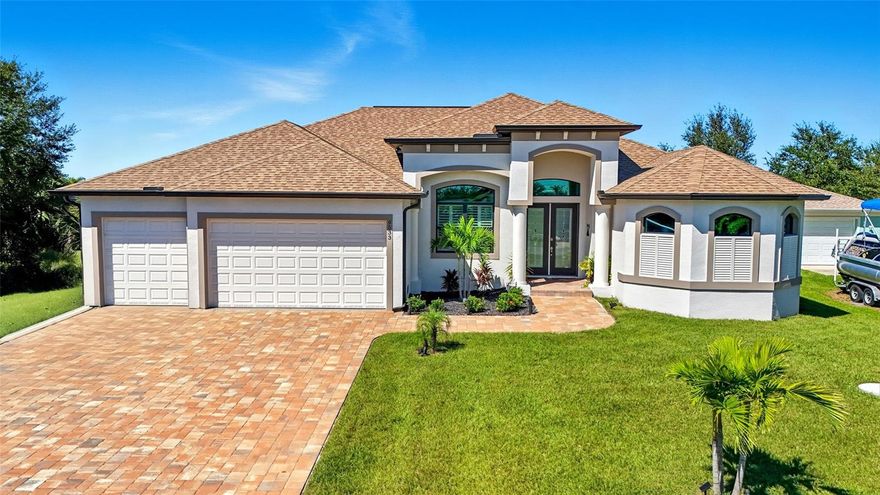 Built in 2023, this immaculate home offers soaring 14-ft ceilings, abundant natural light, and refined details throughout. The chef’s kitchen boasts Brazilian granite, Italian tile, GE Profile appliances, and a custom wood-tone range hood. The primary suite features a tray ceiling, pool access, and a spa-like bath with Roman shower, dual heads, and soaking tub. Additional highlights include two guest bedrooms, a den with French doors, plantation shutters, wide-plank tile, and soft-close cabinetry.

Step outside to your private oasis with an expanded jetted pool and oversized lanai, perfect for Florida living. A 3-car garage with epoxy floors and a golf cart bay completes the package. Located in South Gulf Cove with optional HOA benefits, including a community boat ramp for Gulf access, and with a beach nearby this is a home to see!