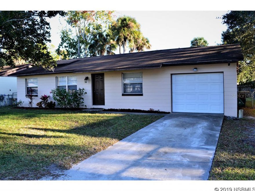 Move in Ready 3 bedrooms, 1.5 baths, split plan Concrete Block home, 1 car garage, kitchen remodeled, tile flooring in living areas, carpet flooring in bedrooms.  Large fenced in back yard.  All this home needs is a new owner.  All lmeasurements are approximate. ;Water: City