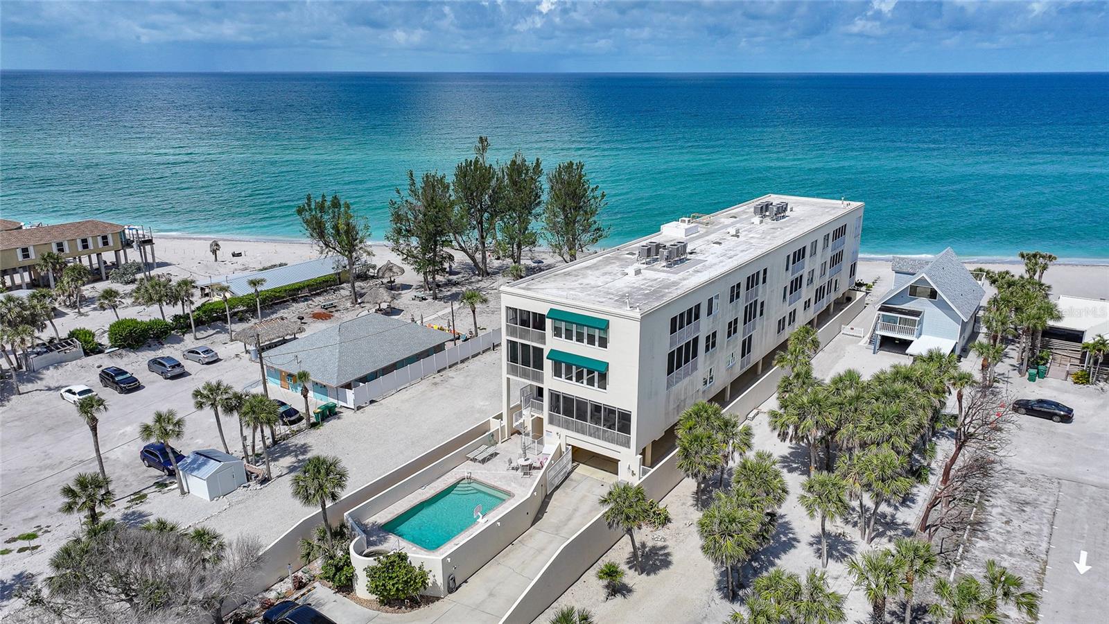 Welcome to Krystal Key Condominiums, an exclusive, gated enclave on the pristine shores of Manasota Key where luxury, privacy, and laid-back elegance converge. This exquisite 2-bedroom, 2.5-bath residence is a rare gem—offering all the sophistication of high-end coastal living while embracing the serenity of the Gulf Coast. This building made it through all storms practically un-scathed, like a local Fort Knox.
Enter through your privately gated drive and enjoy the convenience of two assigned covered parking spaces tucked beneath the building—shielded from the elements and secured for peace of mind. A private elevator delivers you directly to a semi-private grand foyer, which can be key-locked for enhanced security and exclusivity.
Step through double entry doors into a space designed to impress. The open-concept layout is enhanced by PGT impact-rated tilt-and-turn windows and sliders that bathe the home in natural light while offering effortless views of both the Gulf of America and Lemon Bay. Relax in the inviting living area anchored by a modern glass crystal fireplace—a shimmering statement of both warmth and sophistication.
The chef-inspired kitchen is a culinary dream: featuring a massive quartzite island, Bosch stainless steel appliances (including induction range, warming drawer, and refrigerator), a Houzz apron-front sink, extensive cabinetry, and a custom-built pantry with pull-out drawers. Adjacent, a charming media/family room with built-in shelving provides the perfect space to unwind or entertain.
Both bedroom suites are luxuriously appointed with walk-in closets and private baths. The primary suite boasts a spa-like experience, featuring dual vanities, a steam shower, and a deep soaking tub. Step onto either of the two expansive private balconies to enjoy partial Gulf views and the soothing sounds of the surf. The primary balcony also includes hurricane roll-down shutters for added protection and convenience.
Additional features include:
• Impact glass throughout
• Custom chef’s desk with quartzite surface
• Elegant finishes and designer touches in every room
• Access to a saltwater community pool, heated spa, and outdoor grilling area
• Keypad entry, security cameras, and guest parking
• Just a short stroll to Stump Pass State Park, restaurants, and charming island boutiques
Whether you're seeking a full-time residence or a seasonal escape, this home offers unmatched comfort, security, and coastal beauty. Live where others vacation.
Showings by private appointment only.