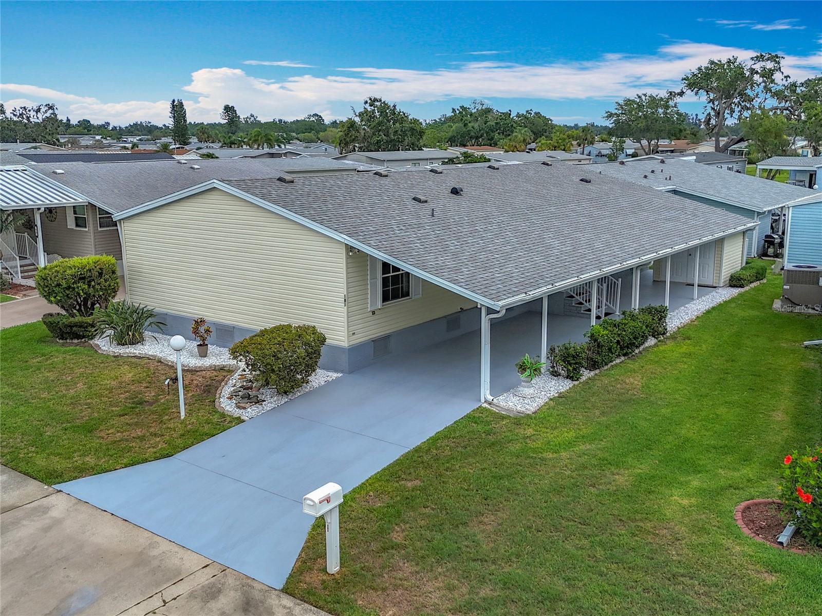 THREE BEDROOMS WITH THREE WALK-IN CLOSETS in this spacious mobile home in an active 55+ community. This well kept home is just waiting for you to make it your own. You enter into the gracious living room and immediately notice how light and airy this home feels. The ample kitchen features a prep island with storage, a built-in desk and new appliances. The adjacent laundry room has extra cabinets and a utility closet. You will enjoy the split-bedroom floor plan where the primary suite is across the home from the secondary bedrooms and second full bathroom. The primary suite features a huge en suite bathroom with garden tub, separate shower and dual sinks. Other features in the home include: New 40 gal. water heater (2025), ADA width doors, hurricane shutters, storage shed, carport, central a/c, and 200 amp electrical panel. The community of Ridgewood Oaks is LAND-OWNED & PET FRIENDLY! Quarterly fees of $731/quarter include 24-hour guarded gate, cable, internet, trash & grounds maintenance. Amenities feature a heated pool & spa, pickleball & tennis courts, shuffleboard, clubhouse, outdoor exercise equipment, and many activities and opportunities to make friends. This home may also be leased with no waiting period making it a possible investment property. Close to I-75, outlet mall, library, dining, retail, and worship. SO MUCH TO OFFER!
