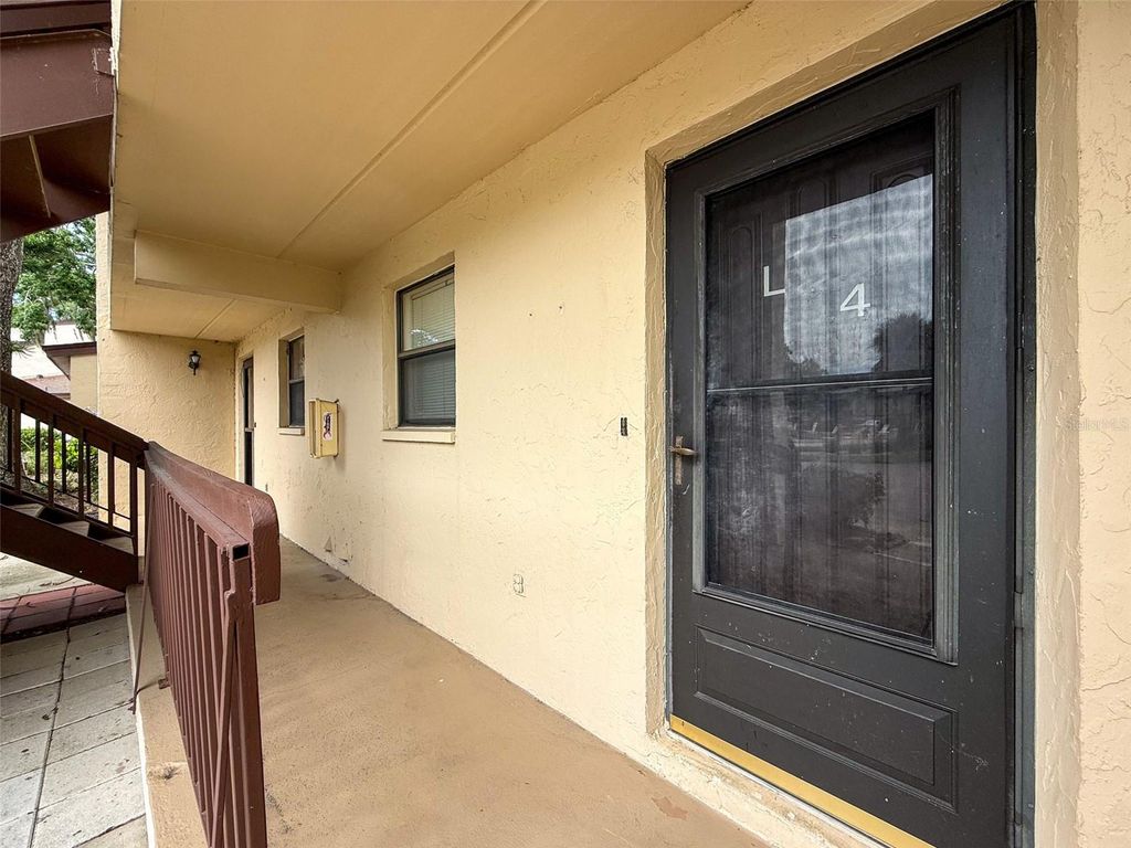 Photo of 1200 Tarpon Woods Blvd #L4, Palm Harbor, FL 34685 (MLS # O6318863)