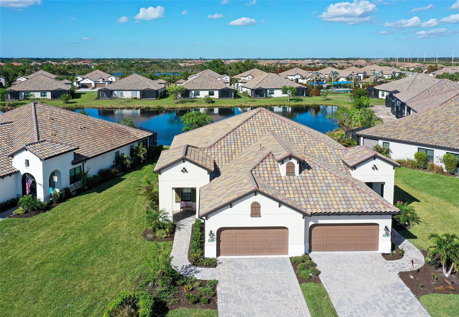 NOW PRICED $150,000 BELOW PURCHASE PRICE IN 2023! This beautifully decorated Boca Royale Sandcastle model features splendid WATER VIEWS from the EXPANDED COVERED LANAI. Built in 2023 and hardly used, this villa has over $70,000 in BUILDER OPTIONS AND UPGRADES. Located in the new Belize section, this roomy 3 BEDROOM, 2 BATH floor plan with a separate DEN/OFFICE is all that you need to call home. The GOURMET KITCHEN includes neutral color cabinets with glass enclosures, upgraded hardware, QUARTZ COUNTERTOPS, custom pendant lighting over the island, and a natural GE gas range for your cooking pleasure. The GREAT ROOM has POCKETED SLIDING GLASS DOORS that enhance your relaxing WATER VIEW, plus a TRAY CEILING framed with CROWN MOLDING, a high-end MINKE FAN and RECESSED LIGHTING to complete the finishing touches. The master suite has a FULL WATER VIEW, RECESSED LIGHTING, a CUSTOM MINKE FAN and generous walk-in closet. The EN SUITE bathroom features DUAL QUARTZ COUNTERTOPS with UPGRADED LIGHTING AND HARDWARE, plus a spacious walk-in shower. The guest bathroom has QUARTZ COUNTERTOPS, custom lighting and a FRAMELESS SHOWER for the comfort of your quests. The separate laundry room has a coveted WASH TUB and a new GE WASHER AND DRYER. Other options include a GAS HOOK-UP for the grill, and an EPOXY garage floor. $45,000 in TASTEFUL FURNISHINGS make this home TURN-KEY READY. In this section of Belize, there is a RESORT-LIKE COMMUNITY POOL just around the corner, complete with cabanas and an outdoor kitchen for your enjoyment. Boca Royale Golf & Country Club is a welcoming, gated community spread across 1,000 acres of oak trees, lakes, and nature preserves, offering a beautiful setting for both relaxation and recreation. Residents can enjoy a newly renovated championship golf course, tennis and pickleball courts, a modern fitness center, and a resort-style pool and spa that create endless opportunities to stay active. The Georgian-style clubhouse is a gathering place for friends and neighbors, with casual and fine dining options as well as a lively calendar of wine dinners, trivia nights, and themed events that make it easy to feel at home. Walking and biking trails, a dog park, and outdoor recreation areas encourage time spent in the fresh air, while the community’s location—just minutes from Manasota Key’s white sand beaches, Venice Island’s boutiques and restaurants, and the shops and entertainment of Wellen Park—adds even more to enjoy. With nearby marinas, parks, and everyday conveniences close at hand, Boca Royale blends coastal charm with a vibrant, connected lifestyle to make it the perfect location for you to call home. CALL TODAY FOR A SHOWING!