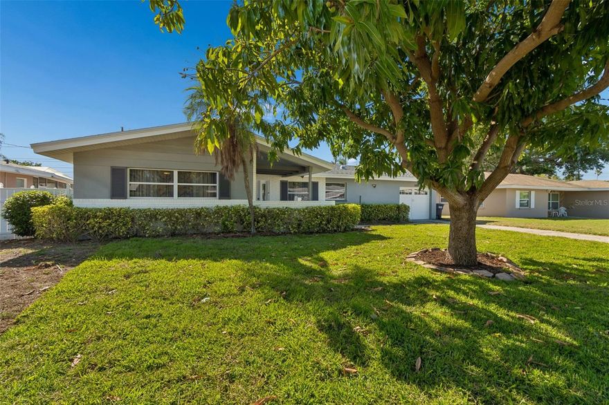 Location! Location! Near to all... Dunedin, downtown Clearwater, Honeymoon and Clearwater Beaches! Beautifully renovated pool home in the desirable Woodmont Park community! No flood zone and no HOA for this nearly 1,600 sq. ft. charmer with 2 bedrooms, 2 full baths and a 1 car garage. Reimagined with a true open concept layout that allows seamless flow throughout the main living areas. The kitchen has been redesigned for fine family living and entertaining, modern cabinetry, gorgeous quartz counters, designer backsplash, stainless appliances and a fabulous peninsula breakfast bar. A sizable dining area flows to the main living space and the magnificent Florida room with gorgeous windows and French doors looking out on the backyard patio and pool. Bright and airy, the flex space has endless possibilities. The perfect setting for an office, sunroom or playroom. The primary bedroom boasts an updated ensuite with designer finishes. The secondary bathroom has also been fashionably updated. The large patio and screen enclosed pool offer an extension of your living space… and the backyard is fully fenced for ultimate privacy. The backyard also houses a stylish shed for additional storage. So much to love and peace of mind with a 2023 A/C system, 2023 windows and doors and 2024 new hot water tank, newer flooring and kitchen and bathrooms are recent updates. The Woodmont community offer a premium location. Enjoy the vibe of delightful Dunedin with its plentiful restaurants, breweries, entertainment and festivals. A short drive will take you to downtown Clearwater and on to the famed Gulf Beaches! Convenient access to airports and medical as well.  Stunning home in move in condition in a prime location. Make it yours!