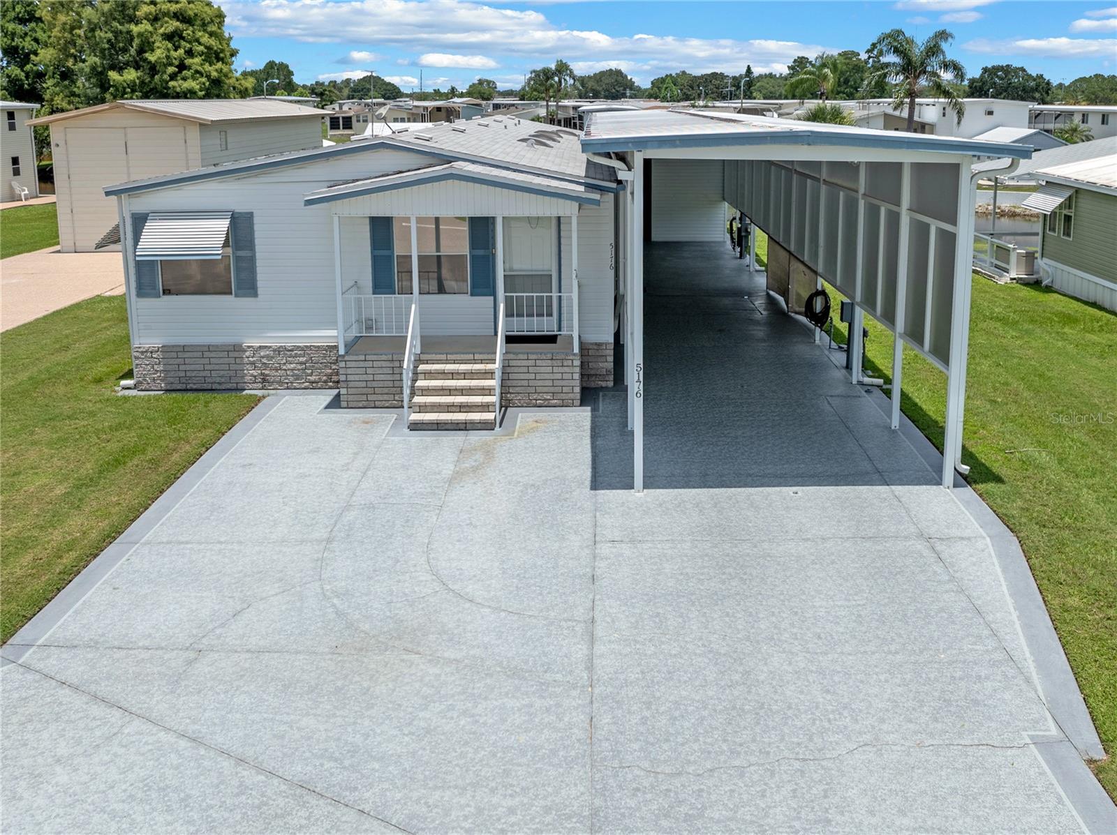 Welcome to your new home—a beautifully maintained Palm Harbor Waterfront RV Port Home, located on a solid concrete slab in Mount Olive Shores. This move-in-ready residence features an expansive floor plan that includes a Florida Room extending from the Master Bedroom, complete with its own private entrance. Additionally, there is a Bonus Room that functions perfectly as a spacious walk-in closet.
The home is equipped with new appliances, updated plumbing, and a newer roof, ensuring modern comfort and safety. Outside, you'll find a large, screened lanai with waterfront views, a brand-new dock, and a motorhome port that can accommodate any RV, including all public utility hookups and 50 Amp service. There’s also a workshop and a two-story storage shed, offering plenty of space for your needs.
The annual HOA fee covers basic lawn care and maintenance of common areas. Mount Olive Shores is a friendly and secure gated community, conveniently located just three and a half miles from I-4. You'll have easy access to numerous shopping outlets, world-renowned medical facilities, Tampa and Orlando International Airports, and Central Florida attractions, all less than an hour away. Please note that this community is deed-restricted for Class A motorhomes, meaning you must own or lease a Class A motorhome during your first year of accumulated residency.