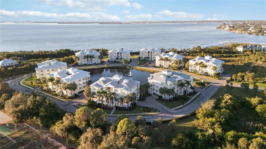One or more photo(s) has been virtually staged. Welcome to the effortless coastal lifestyle you’ve been dreaming of. Tucked inside one of Bradenton’s most sought-after gated communities, this beautifully designed condo places you minutes from the Gulf of Mexico, Anna Maria Island’s sugar-soft beaches, and the sparkling blue waters of Palma Sola Bay. Here, every day feels like vacation - sunshine, salt air, vibrant sunsets, and endless outdoor living are simply part of the rhythm.

Set within a community inspired by relaxed Key West architecture, this residence offers the perfect blend of comfort, privacy, and coastal elegance. Inside, the open layout is bright and inviting, framed by tall ceilings, impact windows, and generous living spaces that echo the airy, sun-washed feel of Southwest Florida. The heart of the home is a spacious kitchen with granite counters, stainless steel appliances, and a breakfast bar ideal for casual mornings before heading out for a paddle on the bay or a walk along the community trails.

The primary suite is a serene retreat with a private balcony - perfect for morning coffee, quiet evenings, or watching soft coastal rain roll across the pond. A large walk-in closet and spa-style bath elevate the sense of everyday luxury. Two additional bedrooms create flexible space for guests, a home office, or multi-generation living.

Step outside and the lifestyle expands around you. Spread across 30 acres of preserved Florida beauty, the community offers three shimmering ponds, wide-open green spaces, mature tropical landscaping, and peaceful spots to unwind. Spend your days enjoying the heated resort-style pool, fire pit, putting green, fitness center, and clubhouse designed for gathering, entertaining, and connecting. Launch a kayak at the community’s bayfront deck, fish at sunrise, watch wildlife, walk the dog, or simply breathe in the Gulf breeze.

With two under-building parking spaces, elevator access, a storage cage, and the convenience of being just minutes from IMG Academy, the Robinson Preserve, Palma Sola Botanical Park, and exceptional dining and shopping, this location truly captures the best of Florida’s Gulf Coast.

Whether you’re seeking a full-time residence or a seasonal escape, this condo offers more than a home - it offers a lifestyle defined by sunshine, wellness, water, and the freedom to enjoy it all year long.