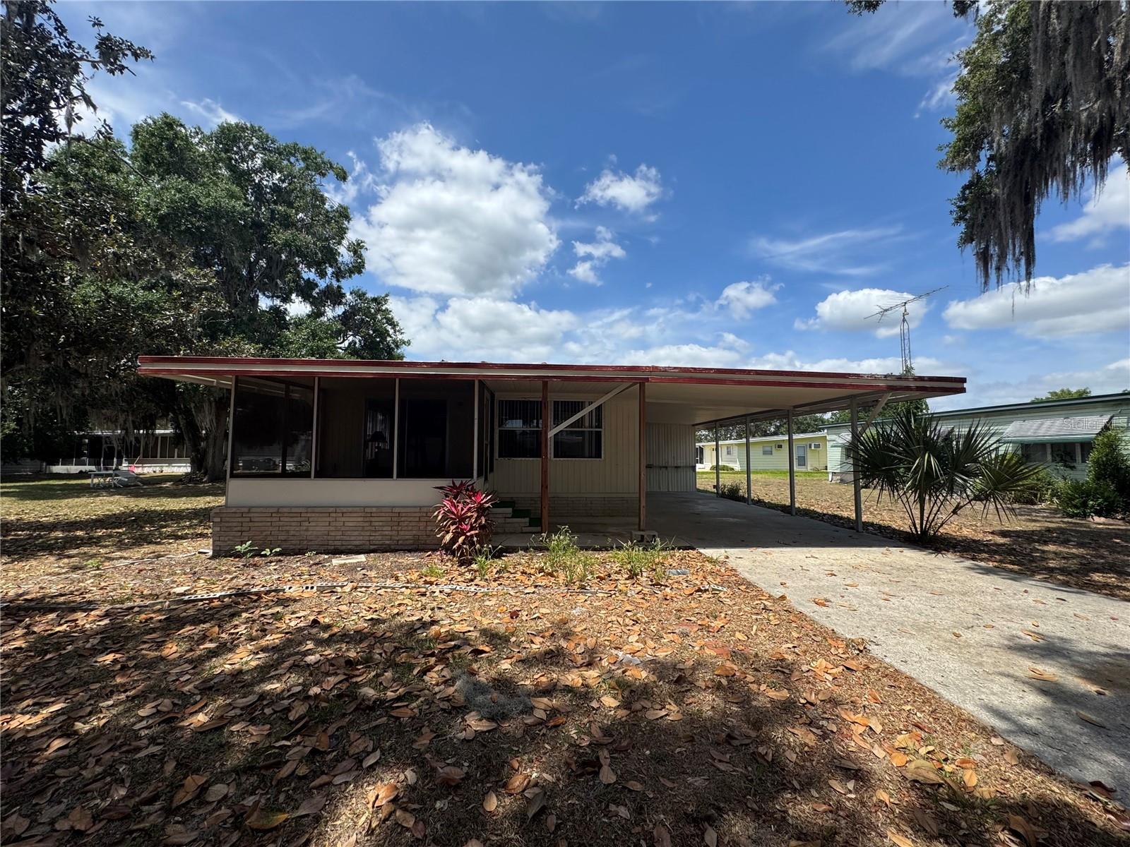PRICE ADJUSTMENT!! REDUCED TO SELL!! Looking to live near The Villages in an active community with a championship golf course? Here it is! This 2-bedroom, 2-bathroom home is perfectly located with beautiful golf course views, close to the clubhouse, and just a short walk to Lake Okahumpka, where you can enjoy fishing and peaceful nature walks.
Step inside and discover a spacious layout featuring a front living room, formal dining room with a built-in hutch, and a comfortable guest bedroom with two closets and a nearby guest bath. The primary suite boasts a walk-in closet, linen closet, and ample cabinet space throughout the home for all your storage needs.
Situated on a generously sized lot, this home offers the perfect setting for relaxation and retirement. Don’t wait—call your agent today and make this home yours!
