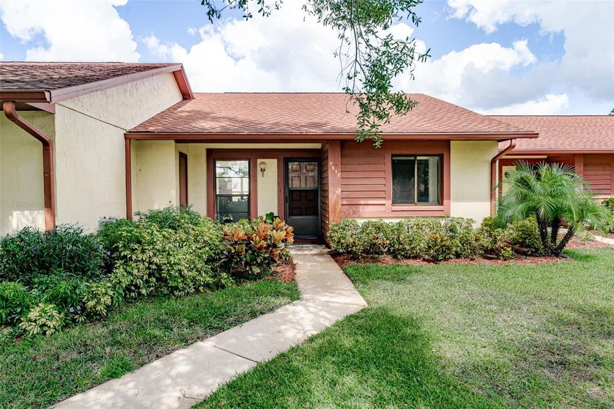 Charming 2-bed/2-bath Condo with Florida Room in Hudson!  Looking for easy living in a cozy Florida Community?  This adorable 2-bedroom, 2-bath condo is nestled in a small, quaint neighborhood surrounded by beautiful rolling landscape views and just minutes from a golf course, an activity center, and all the essentials!  Inside, you'll love the bright Florida room - perfect for relaxing or entertaining - plus walk-in closets in both bedrooms and a large storage room closet for extra convenience.  The kitchen comes fully equipped with all appliances, including a full-size washer and dryer.  Enjoy an active lifestyle with shopping, dining, beaches, parks, banks, and more just around the corner.  Whether you're looking for a full-time home or a sunny seasonal getaway, this low-maintenance gem is a perfect fit.  Call today for your private showing - this one won't last long!
