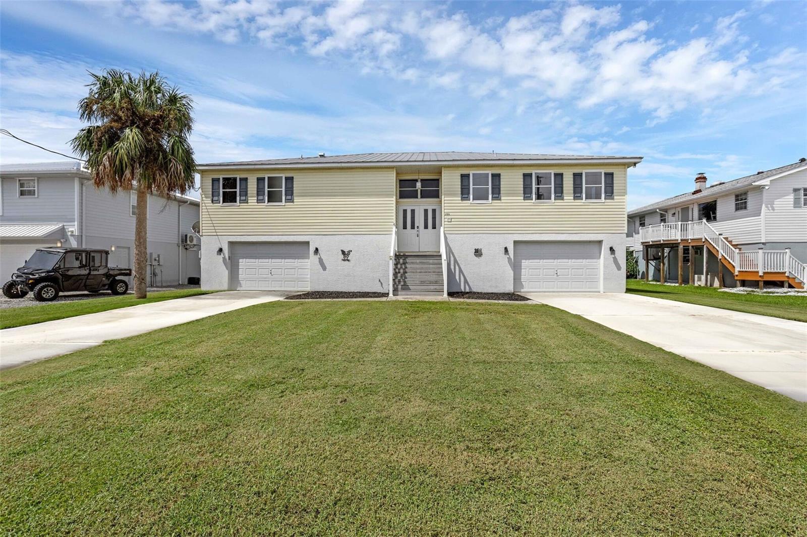 Welcome to your waterfront retreat in Crystal River! Perfectly situated on a deep-water canal, this elevated home offers direct access to Crystal River and the Gulf for larger boats and effortless adventures to the springs, where manatees and dolphins are frequent visitors. Just minutes from charming Downtown Crystal River’s shops, restaurants, and festivals, the location captures the best of coastal living with convenience at your fingertips. Inside, over 2,000 sq. ft. of thoughtfully designed living space features a bright open floor plan, vaulted ceilings, and panoramic sunset views from nearly every angle - including the spacious living area, primary suite, and expansive balcony and lanai. Freshly painted interiors, updated appliances (including a gas cooktop), and a cozy gas fireplace with dedicated propane make the home both inviting and functional. All living spaces are located upstairs maximizing views throughout. Downstairs, you’ll find over 2,000 sq. ft. of garage space - perfect for storing vehicles, water toys, or creating a workshop, gym, or game room. The possibilities are endless. The outdoors is built for simple Florida living: enjoy fishing, kayaking, or paddle boarding right from your backyard, or take advantage of your two docks, including one covered with a lift, for easy boating access. The large backyard is a blank canvas with room for a pool, while the durable metal roof provides lasting peace of mind. Whether you’re seeking a second home, a weekend getaway, or a full-time boater’s paradise, this property delivers the perfect blend of relaxation and adventure. Step in, settle down, and savor the waterfront lifestyle Crystal River is known for.