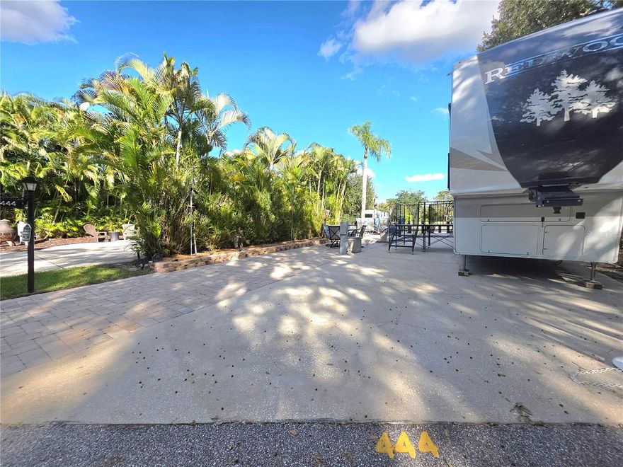 Welcome to luxurious 444 Waterway Drive — a waterfront paradise in the prestigious River Ranch RV Resort. This stunning lot combines high-end upgrades, comfort, and unbeatable location for the ultimate outdoor camping experience.
Property Highlights: Brand New Outdoor Kitchen – a $50,000+ investment, designed for entertaining and relaxation, Brand New Private Dock and Seawall, perfect for enjoying the peaceful canal views from your very own dock swing, Beautiful partially pavered pad, bordered by lush mature landscaping for added privacy and charm.  Turn-key and ready for your RV!  Property Sale includes Metal Table & 4 Chair Set at front of Lot and Dock Box. RV is NOT included with property sale.
Just minutes from the Phase 3 pool and hot tubs.  Close proximity to restrooms, laundry facilities, and the newly renovated pickleball courts
Adjacent to Westgate River Ranch Resort & Rodeo, featuring on-site restaurants, entertainment, and family-friendly activities (for an additional cost)
***High Top Table & 2 Chairs, 4 Chairs with Cushions & Table set DO NOT convey*** Dock Measurements are approximate and should be verified by buyer