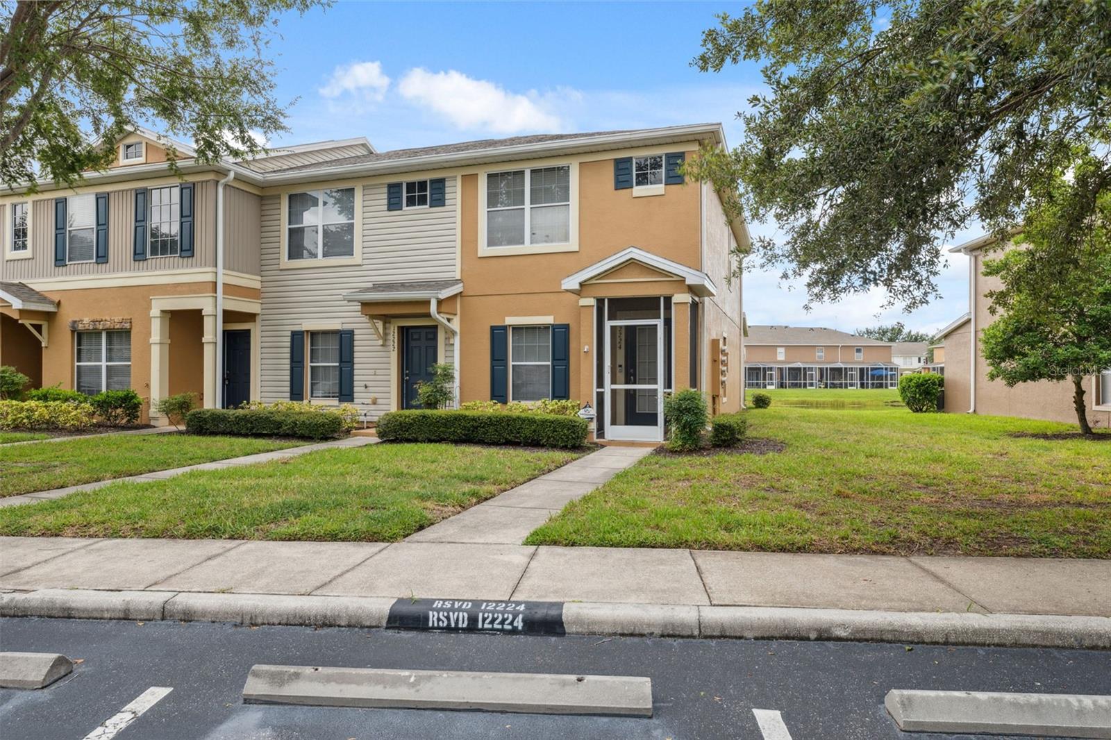 Panther Trace End-Unit Townhome, Beautifully maintained 2BR/2BA (+1 half baths) home with serene pond views. Features include fresh paint inside and out, new flooring, accent walls, and a spacious kitchen with stainless steel appliances, recessed lighting, and a walk-in pantry. Both bedrooms have ensuite baths; the primary suite offers his & her closets and pond views. Enjoy a large screened lanai, 2020 roof, and 16 SEER AC (2019) with UV air-purifying lights. Close to shopping, dining, and community amenities.