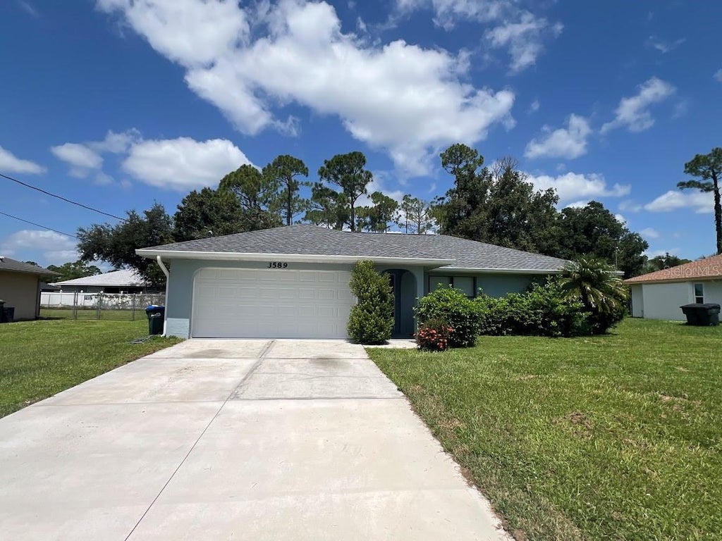 Photo of 3589 N Chamberlain Boulevard, North Port, FL 34286 (MLS # C7529661)