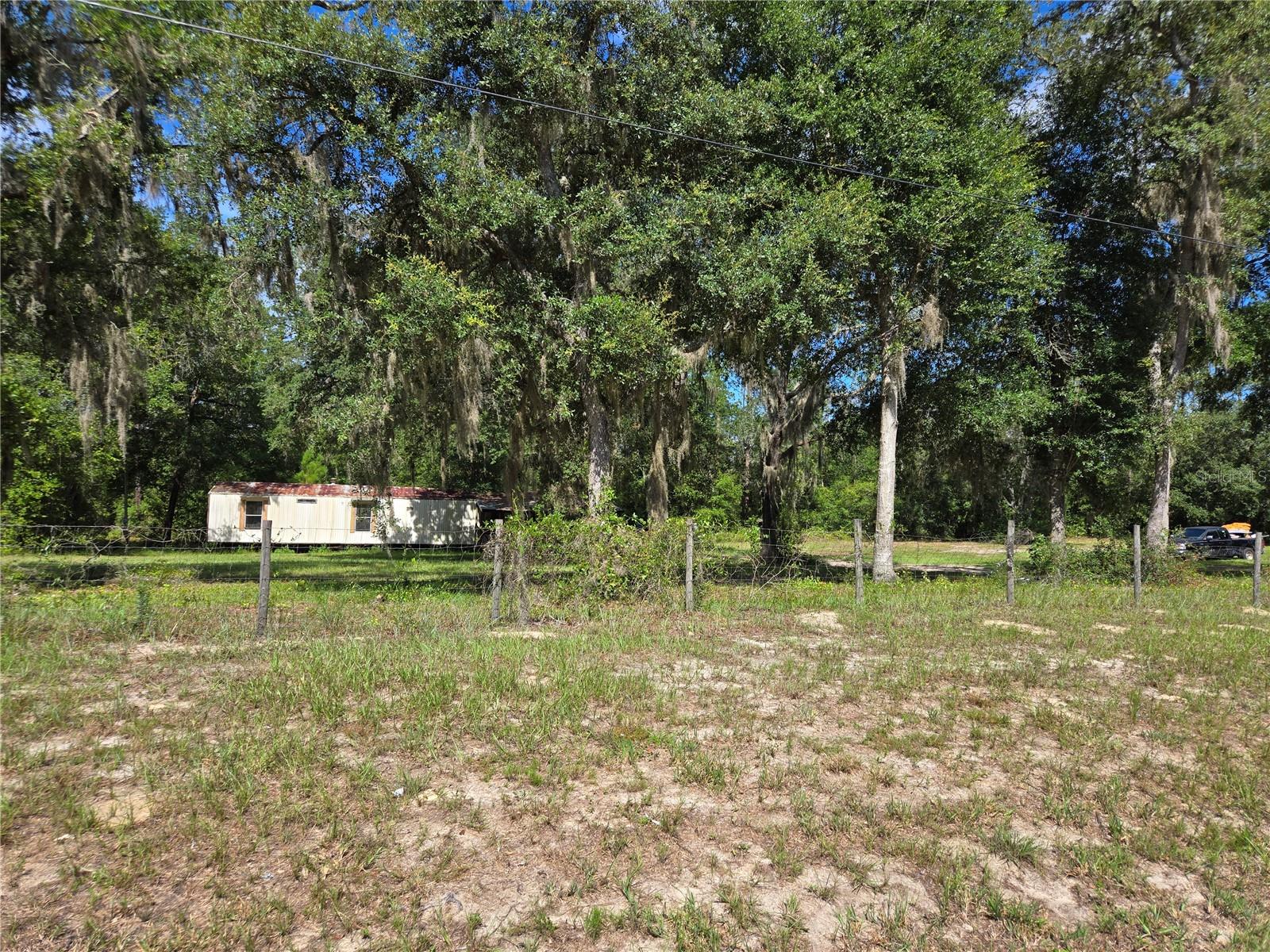 HUNTERS, trail riders, nature enthusiasts: THIS ONE IS FOR YOU! If isolation is your jam & wildlife in your yard a dream - this is IT! This literal slice of heaven abuts 53000 acres of Gothe Forest land!! There is a single wide with no value being left for the convenience of well, septic & power. The fun starts at the driveway here as the forest is mere feet from it. The Gothe is a highly sought destination for equestrian activities and this will not last! Call now to set an appointment!