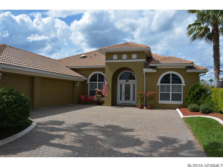 Expanded Barcelona Model by Paytas Homes. Walk into wide open spaces, soaring ceilings, wall of glass out to fabulous pool and serene lake view. Enjoy the spacious living area, large dining room all with high arched entrances. 3 bedroom split plan with office/den/study.. Huge master suite with sitting area and beautiful bath. Frameless corner window in breakfast room overlooking lanai, screened pool and lake.Outdoor covered living area and outdoor kitchen complete the pool ambiance. Open kitchen is a delight with tons of cabinets, a huge pantry and glass top stove. 8 ft doors throughout and wood plantation shutters included. 3 CAR GARAGE with separate shop area, security system, transfer generator hook up and the list goes on and on. THIS ONE IS BEAUTIFUL. ;Water: City